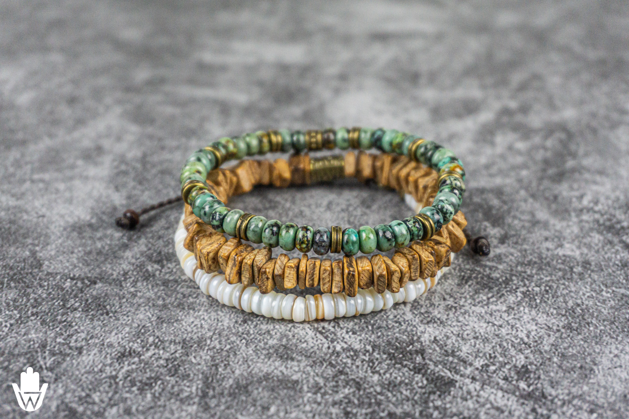 triple bracelet set composed by one green gemstone bracelet, one coconut shell bracelet and one white seashell bracelet- wander jewellery