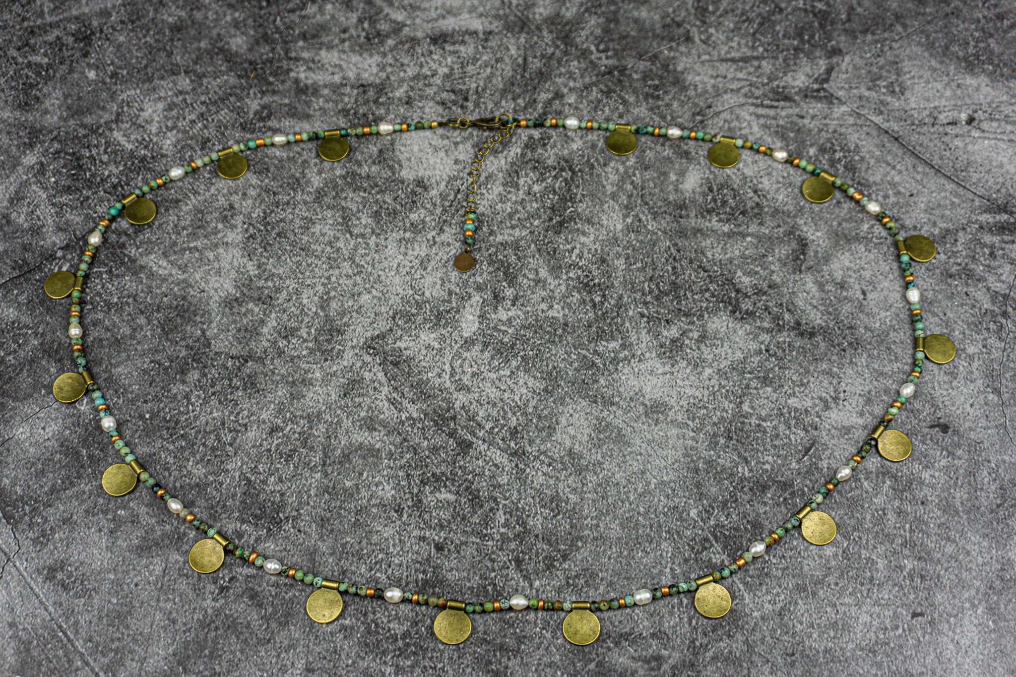 Boho chic belly chain with African turquoise jasper, pearls, and bronze coin charms for a sexy, summery look – Wander Jewellery