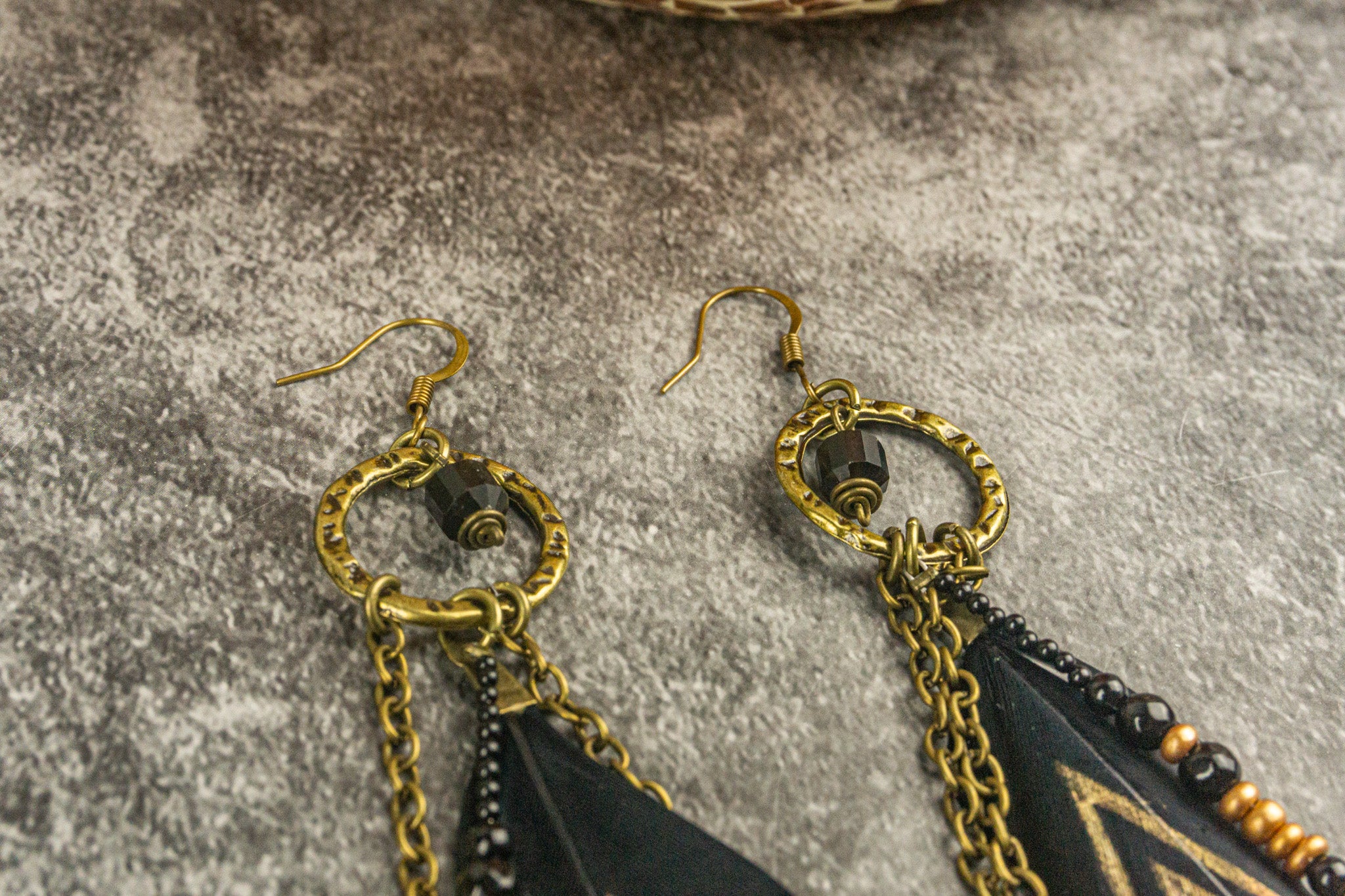 black and gold feather earring with beads and gemstones- wander jewellery