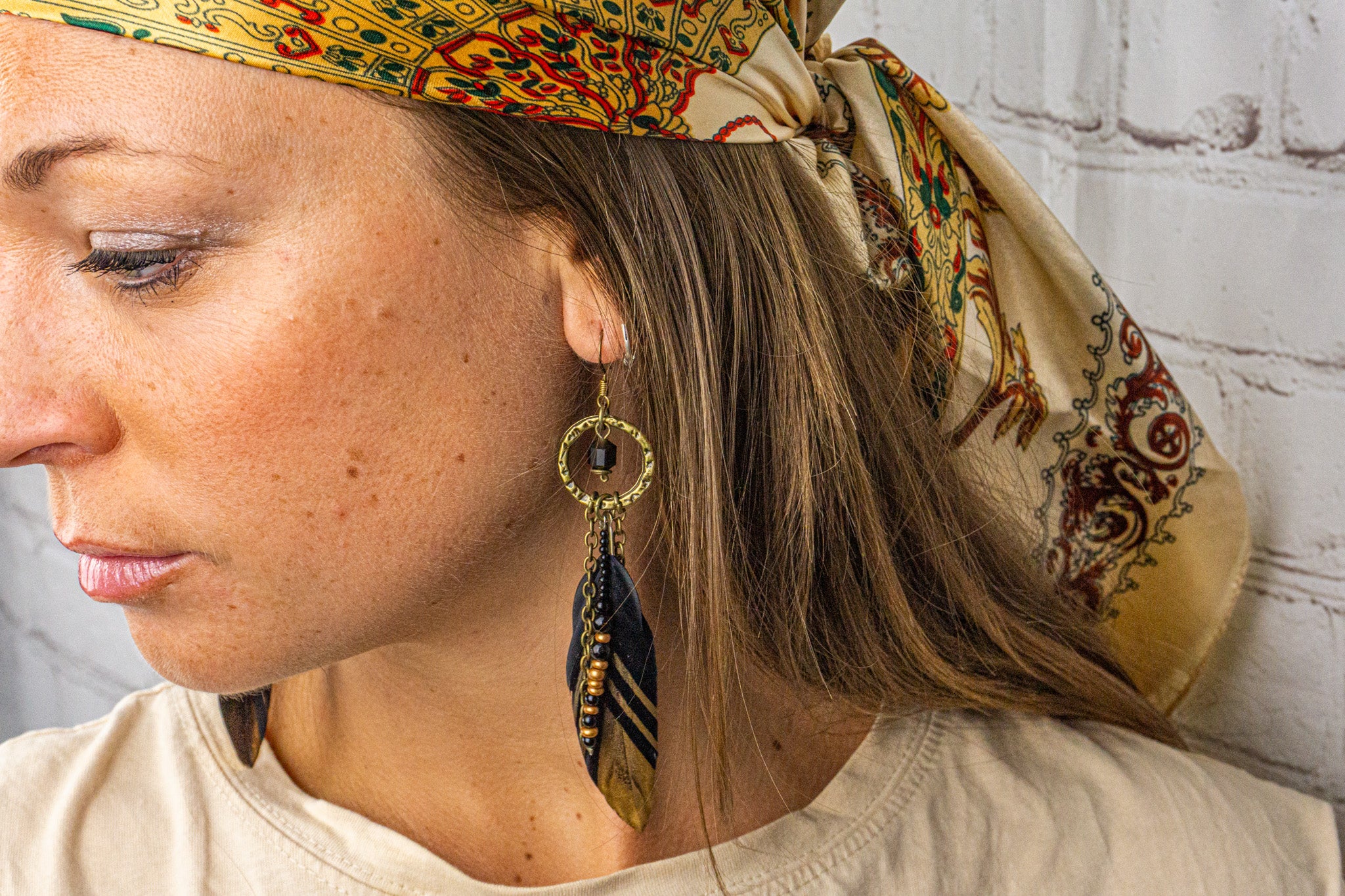 womens boho chic feather earring with beads and black gemstones- wander jewellery