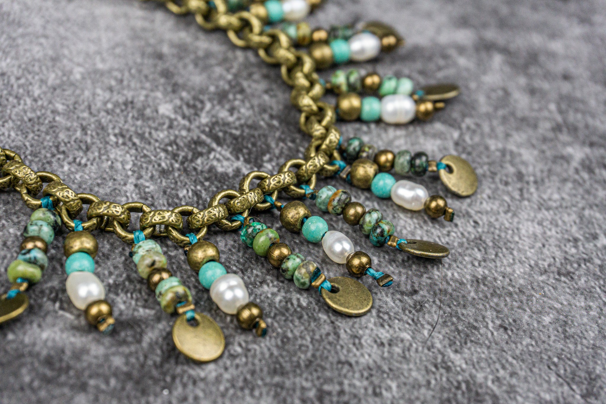 Boho chic pearl anklet with African turquoise jasper gemstones, brass beads, and a brass coin charm – Wander Jewellery"