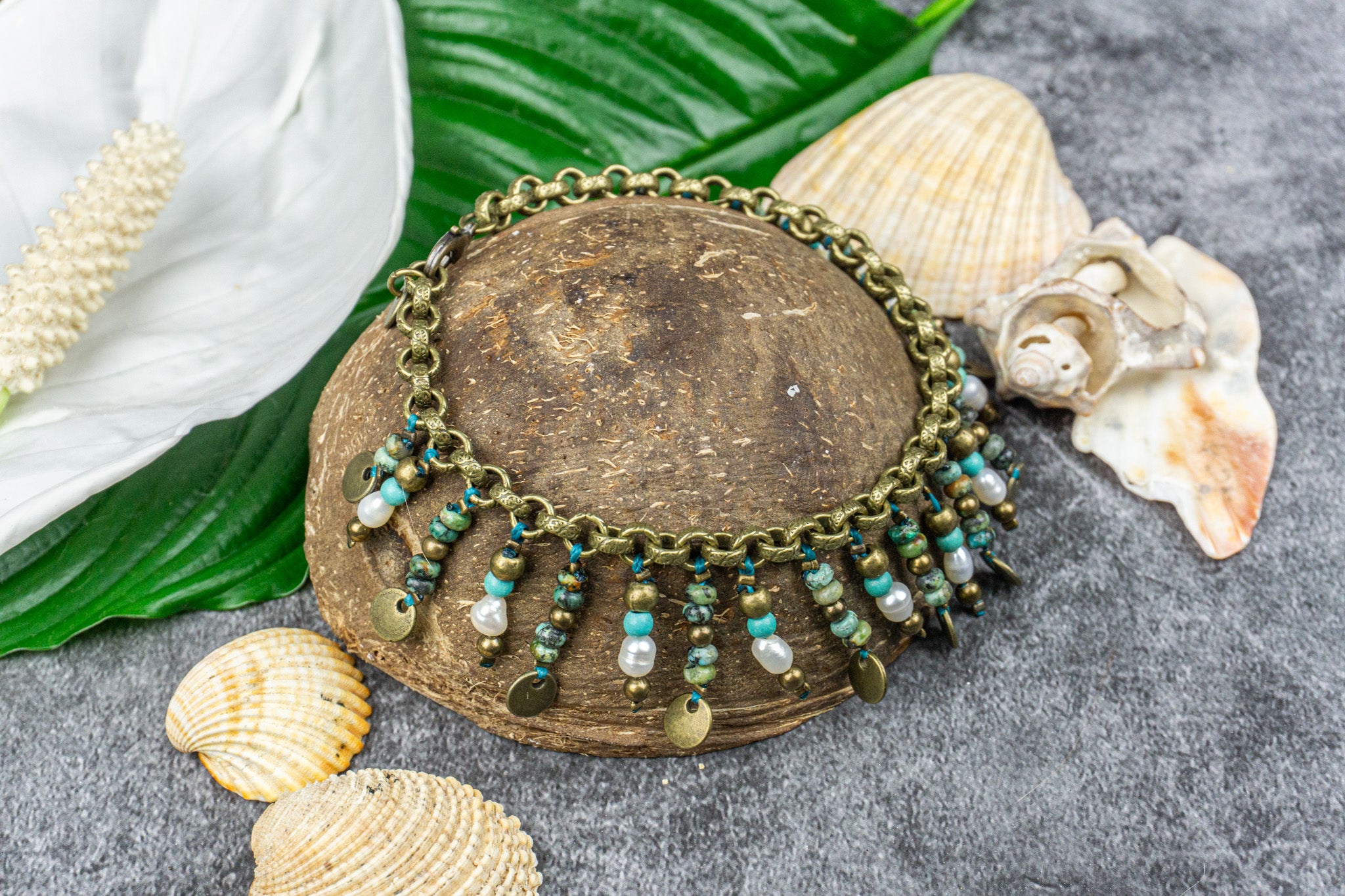 Stylish anklet with gemstone beads, pearls, and a brass coin charm, perfect for a boho-chic summer look – Wander Jewellery