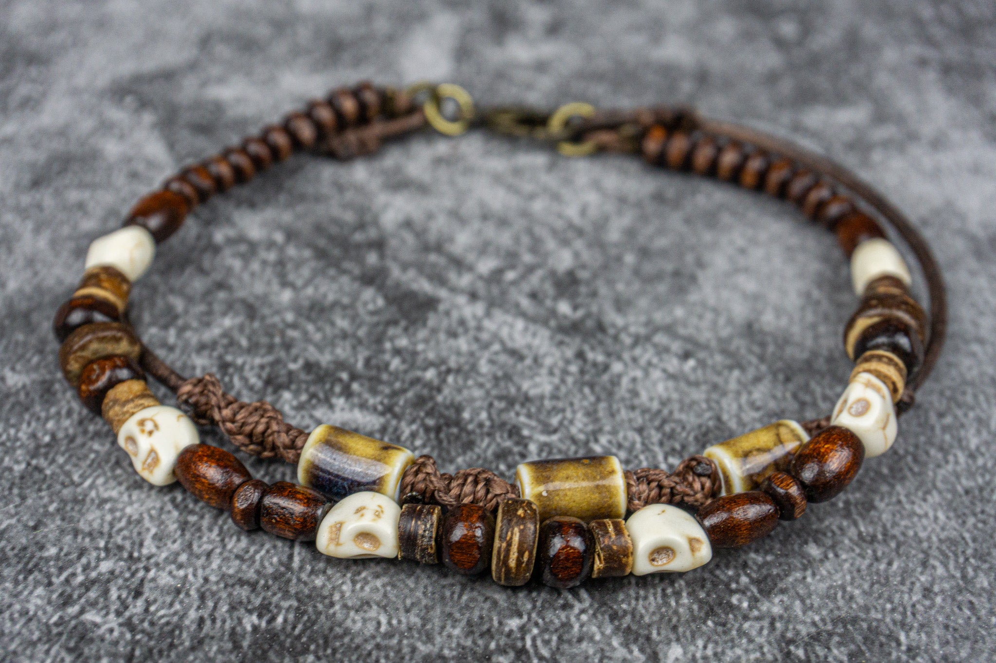 Leather beaded anklet with pirate skull beads, wooden and coconut accents, and macramé patterns – Wander Jewellery