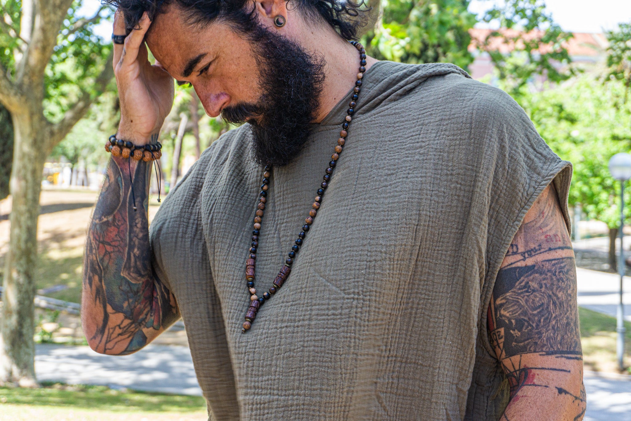 mens dark ebony wood and elephant skin beaded necklace with bronze beads and three carved ebony wood pieces