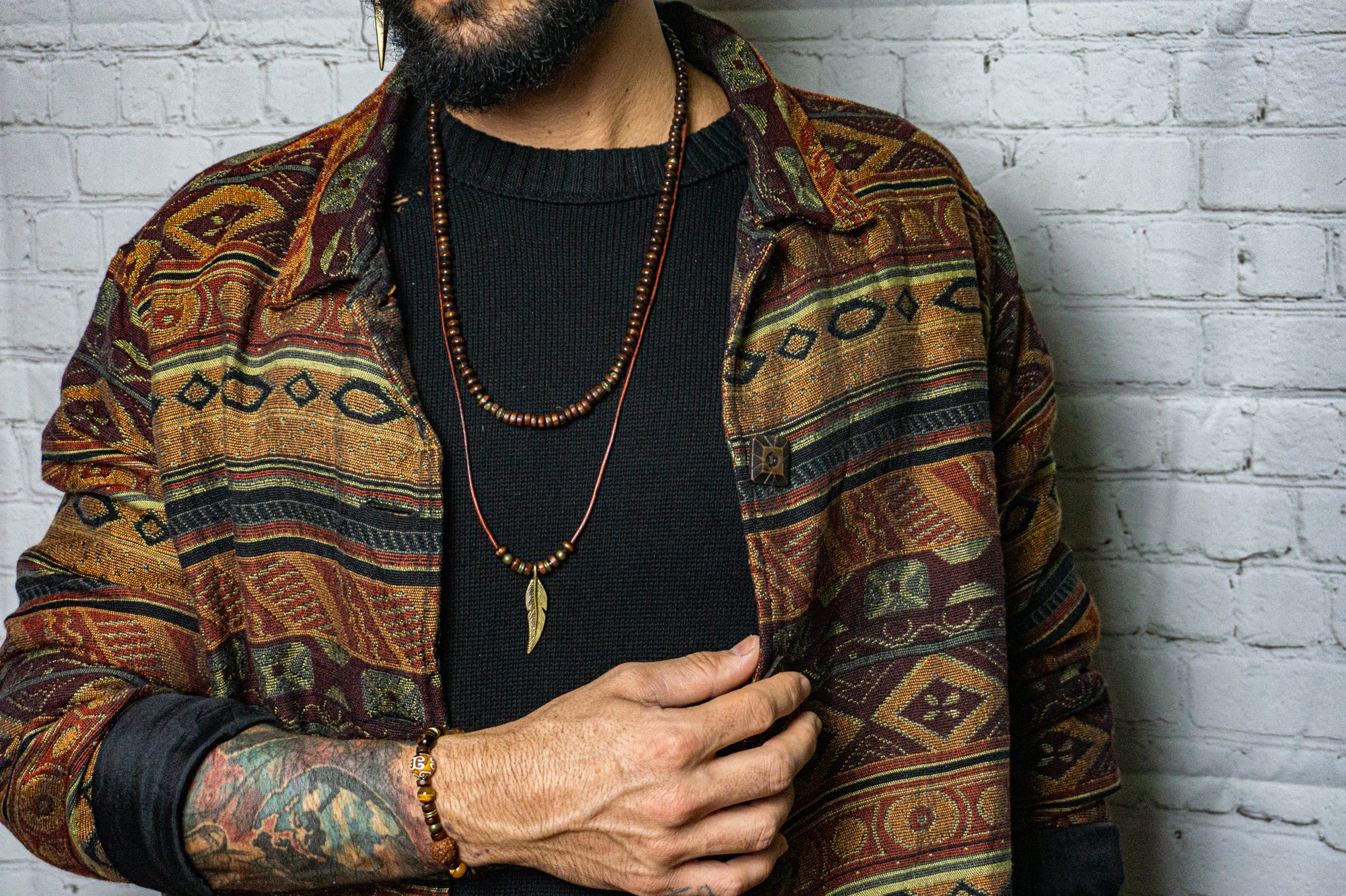 mens layered necklace set made of a wooden bead necklace and a leather necklace with a feather as a pendant- wander jewellery