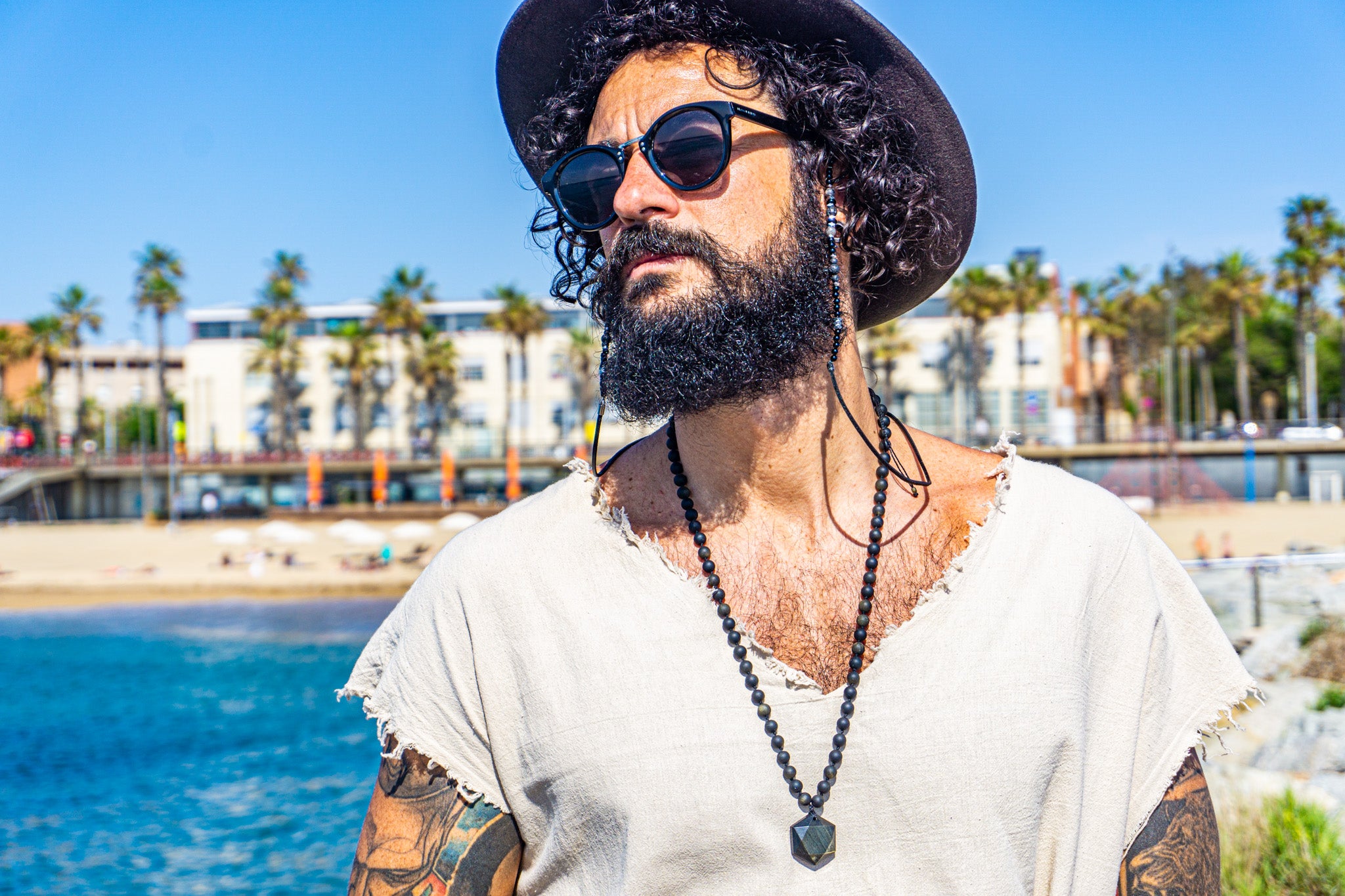 mens long obsidian beaded necklace with a geometric obsidian - wander jewellery