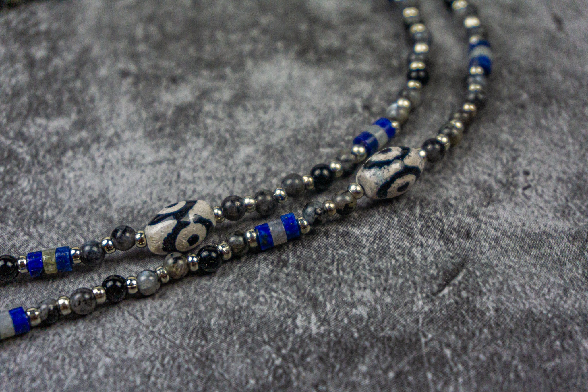 third eye agate beads in a boho necklace made of labrdorite, onyx and lapis lazuli gemstone, with stainless steel spacer beads- wander jewellery