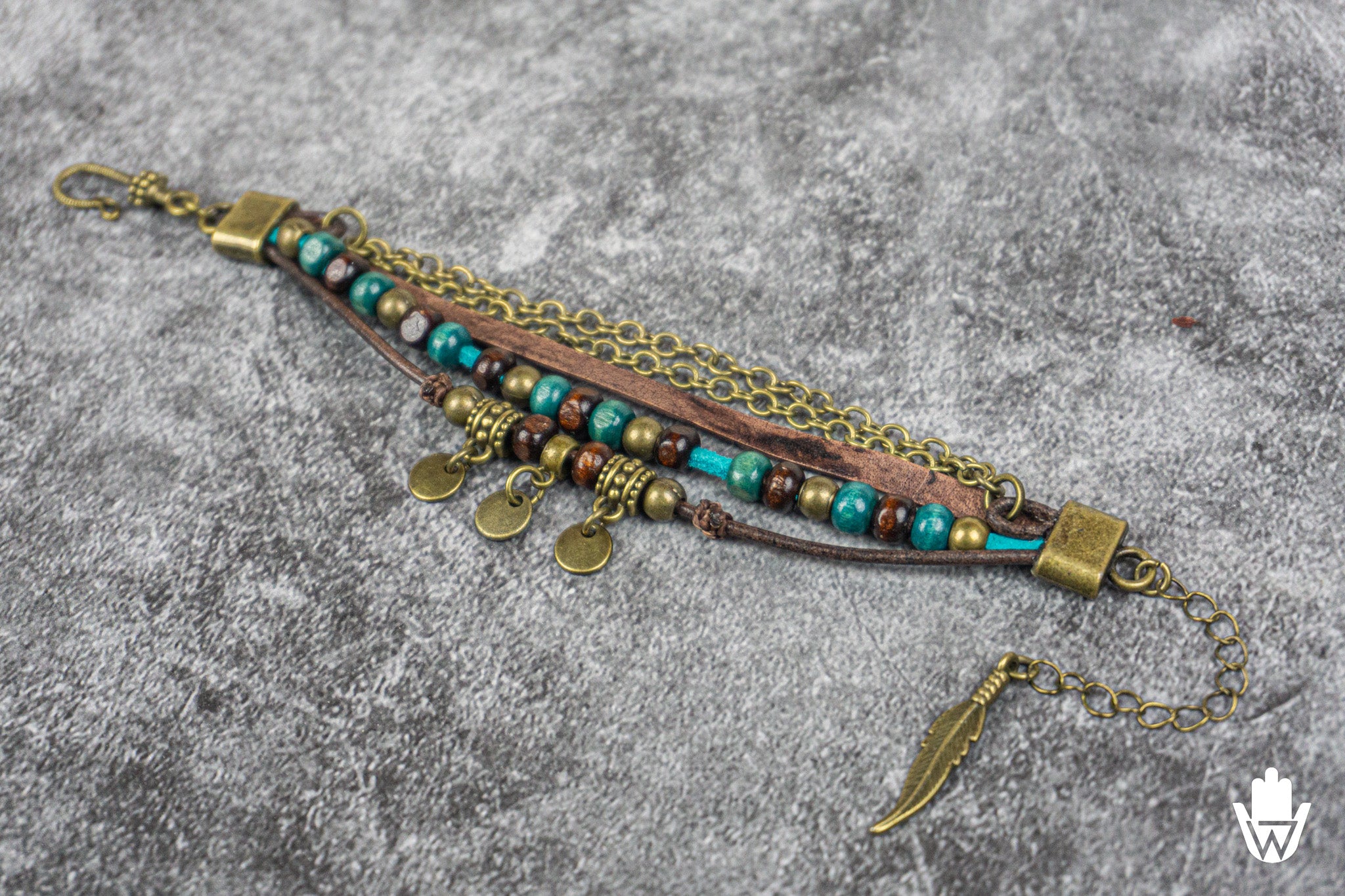 Layered Bracelet with wooden beads and charms on a textured surface