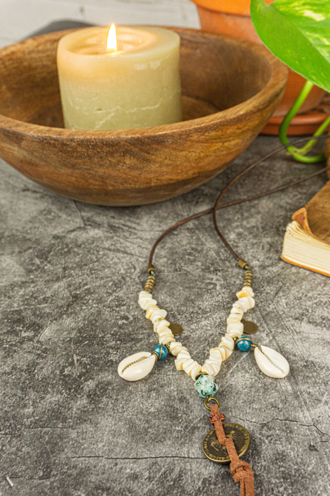 leather necklace made of brass beads and white coral , with coin and cowrie shell charms-wander jewellery