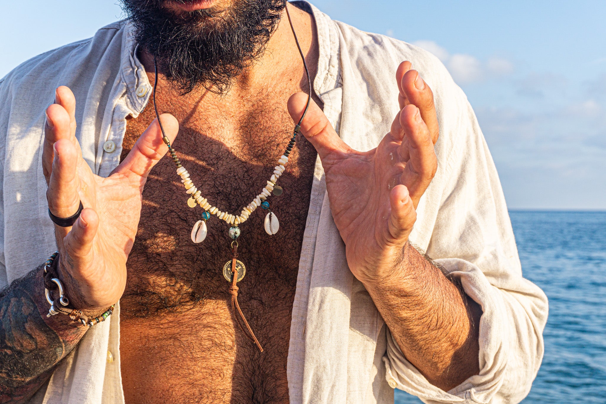 mens leather necklace made of brass beads and white coral , with coin and shell charms-wander jewellery