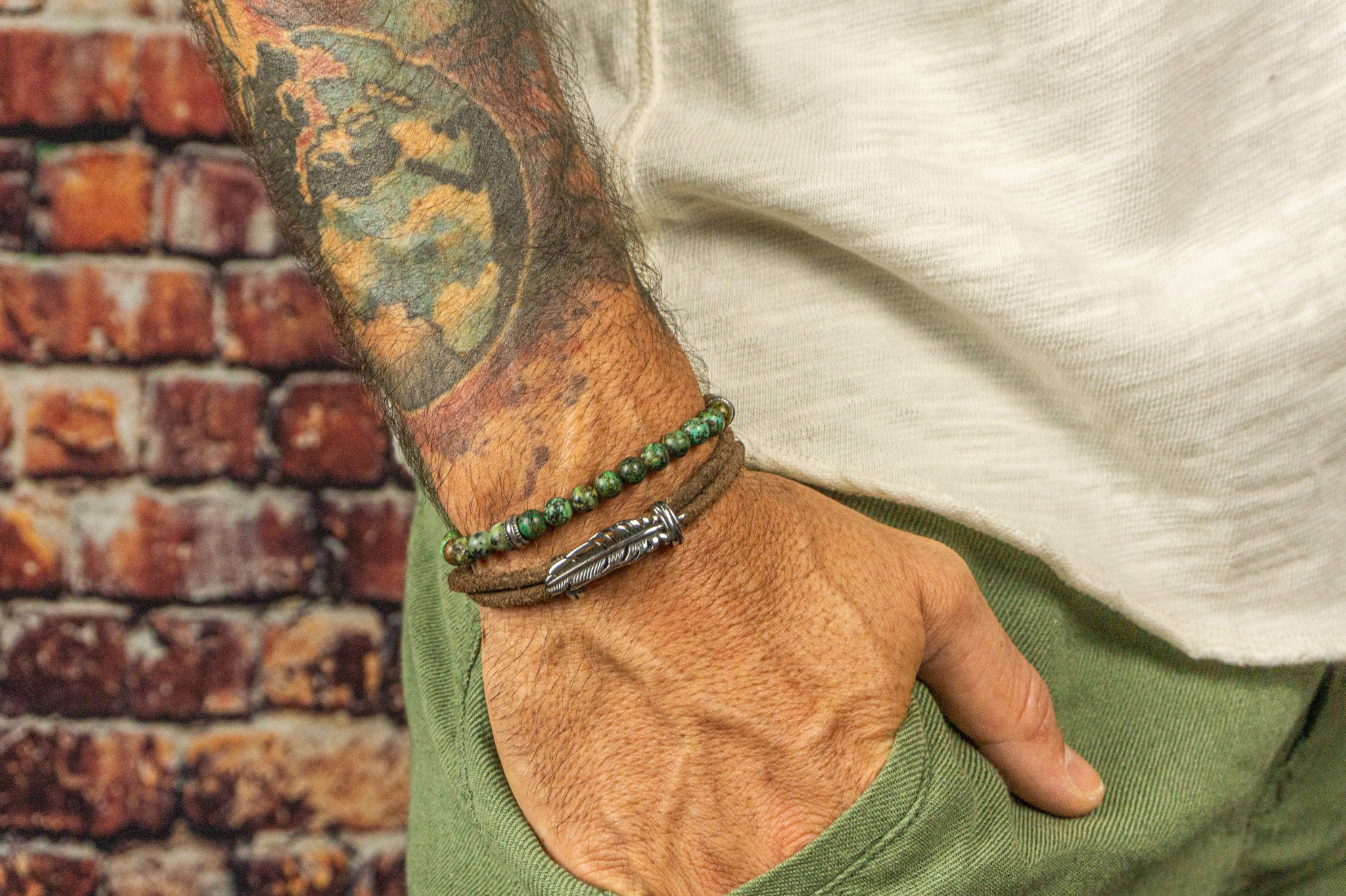 man leather wrap bracelet with silver feather and green african turquoise bead matching bracelet set of 2- wander jewellery