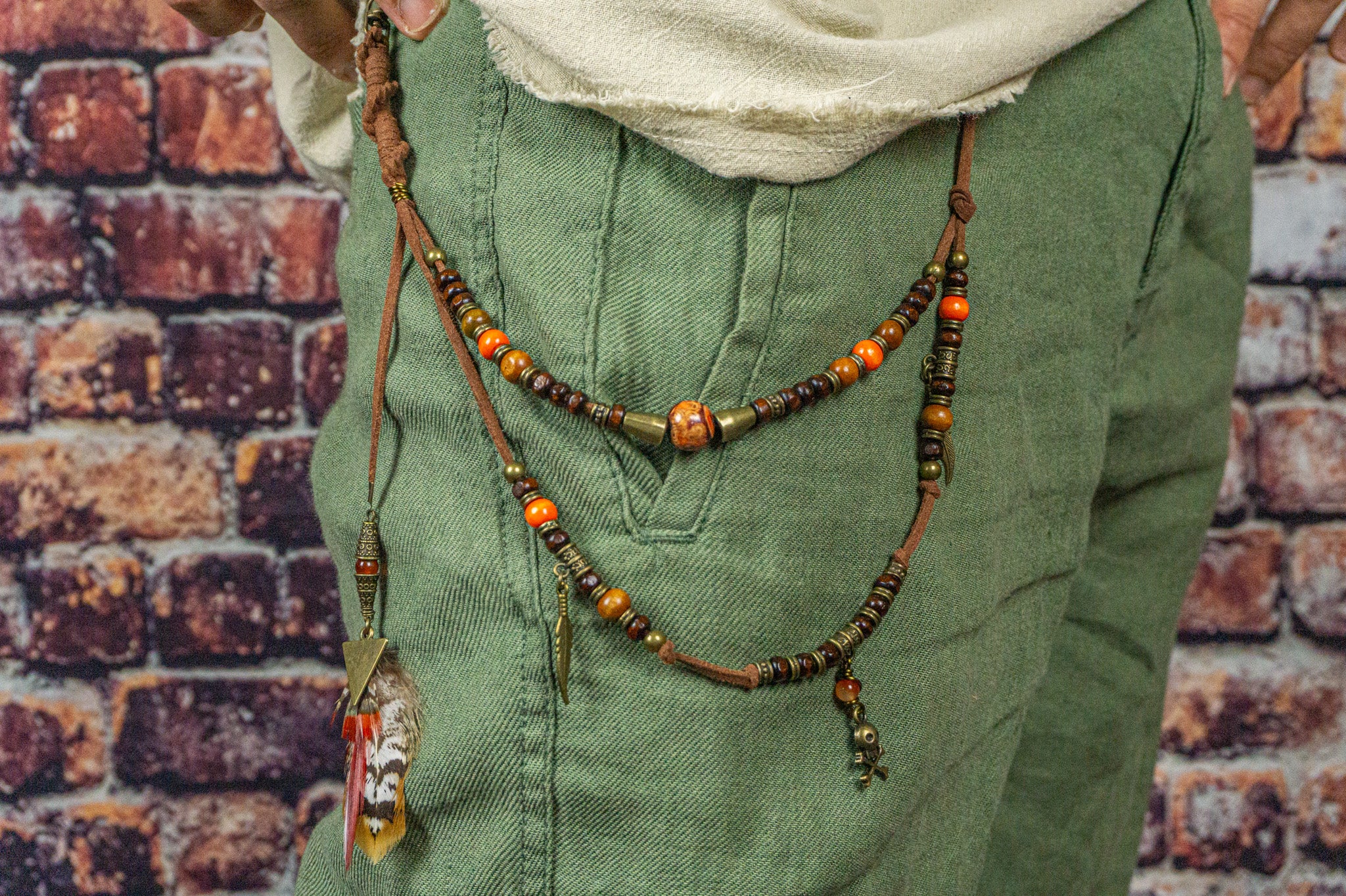 leather and wooden layered pants keychain with feathers and bronze  charms- wander jewellery