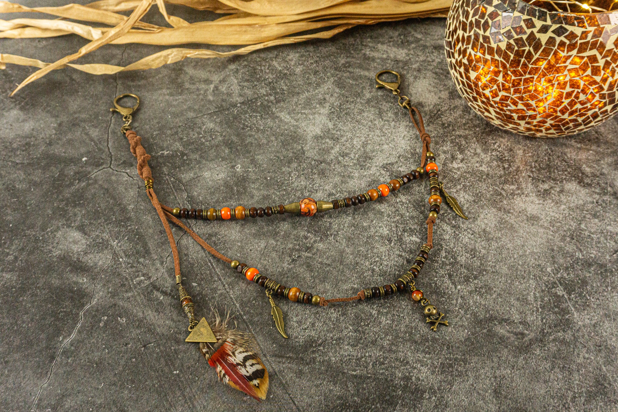 leather and wooden bead layered pants keychain with feathers and bronze dangle charms- wander jewellery