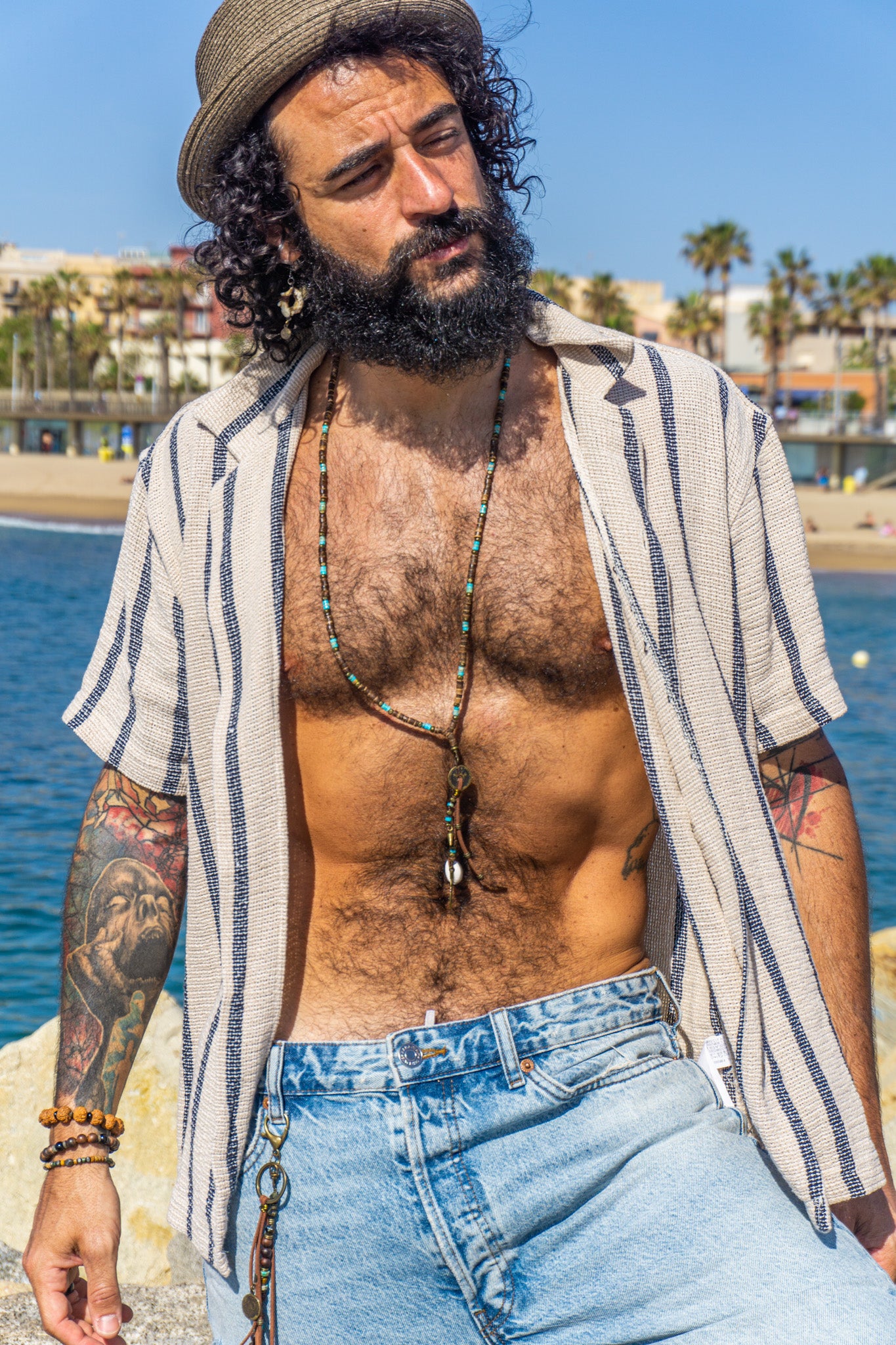 mens extra long coconut shell and gemstone bead, with a long tribal multi charm pendant- wander jewellery