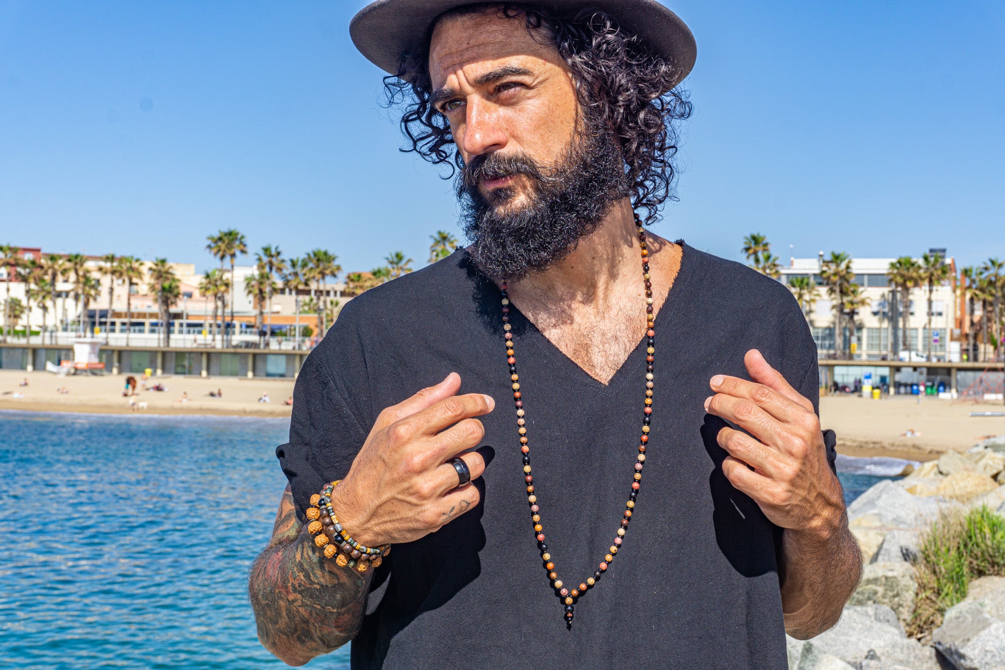 mens long colorful wooden beaded necklace with black onyx pendant- wander jewellery