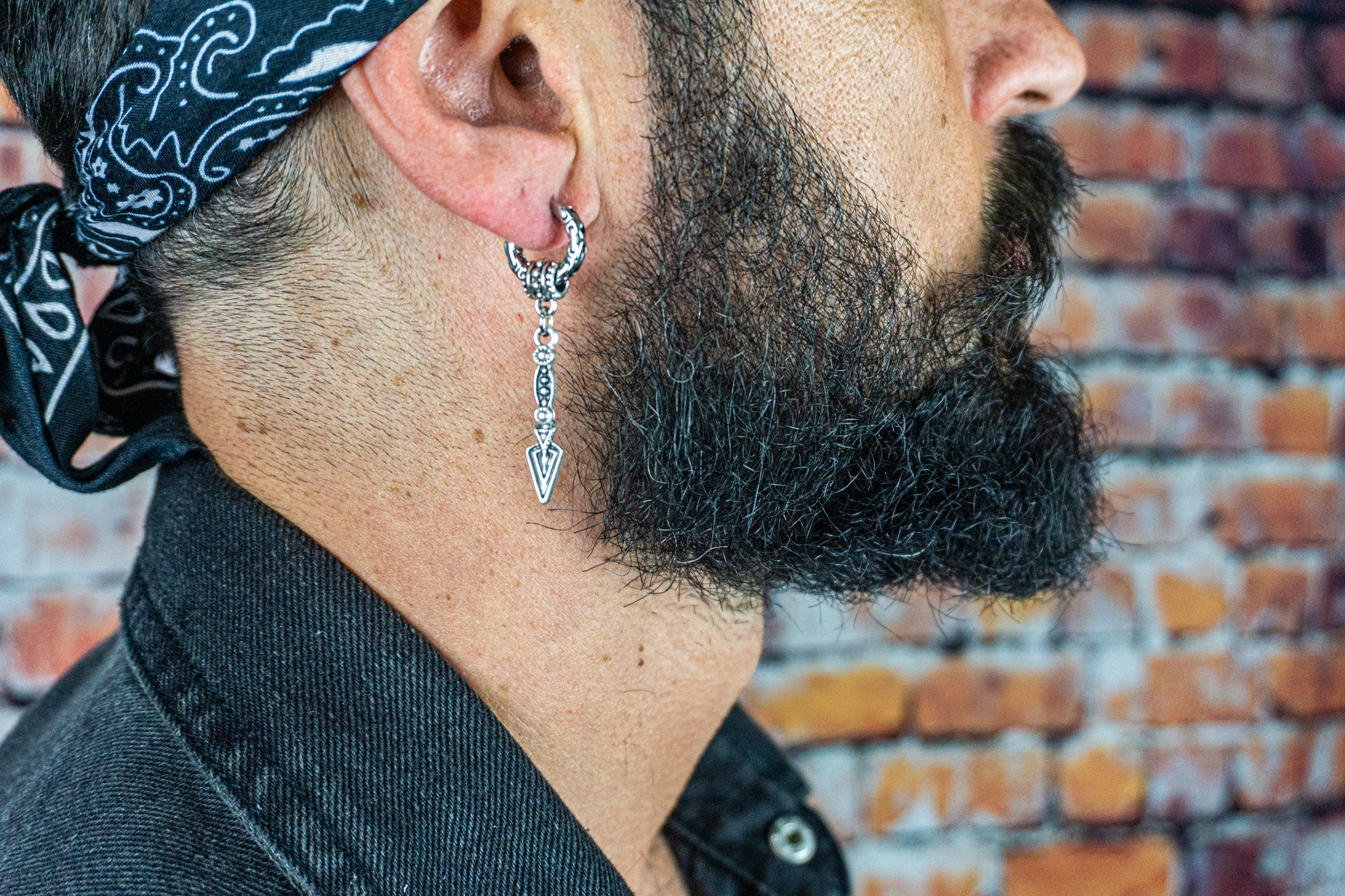 mens cool tribal stainless steel hoop earring with a long dangle arrowhead charm- wander jewellery