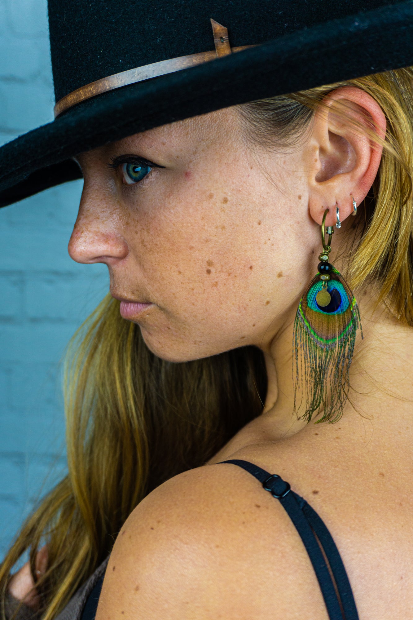 hoop earring for women with a peacock feather and dangle coin- wander jewellery