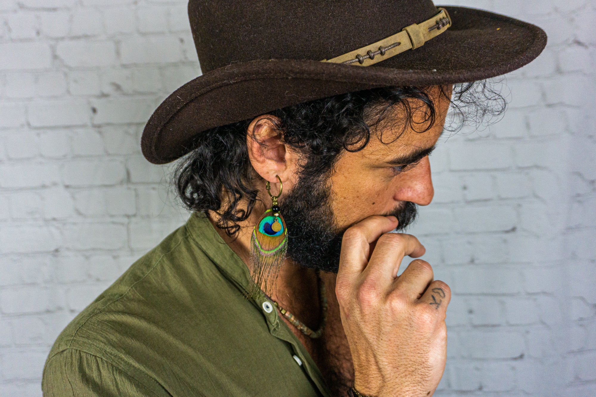 hoop earring for men with a peacock feather and dangle coin- wander jewellery