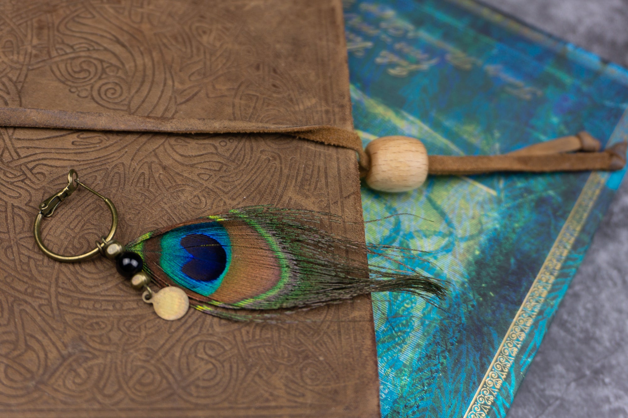 hoop earring with a peacock feather and dangle gemstone- wander jewellery