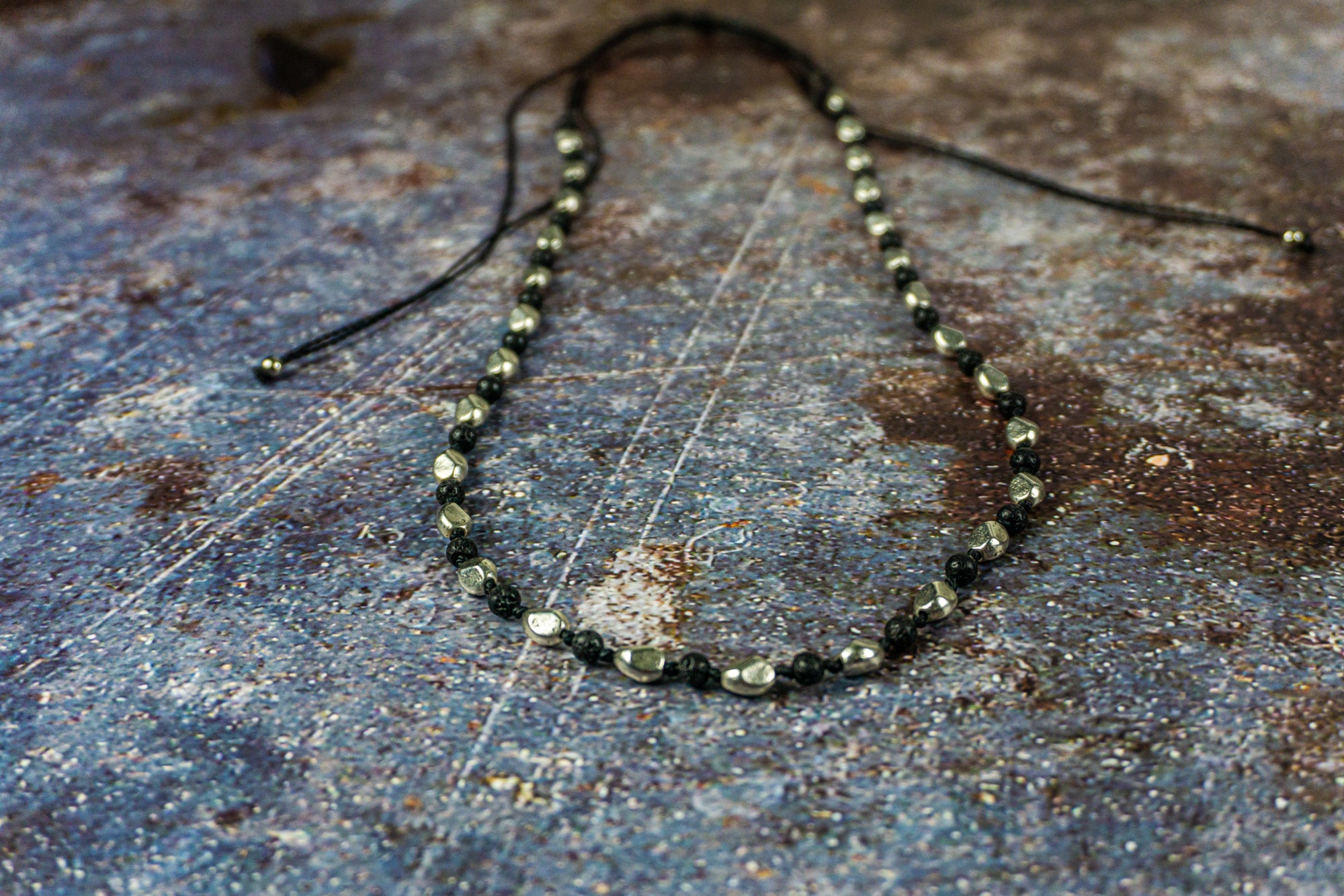 long adjustable necklace made of silver nuggets and black lava stone beads- wander jewellery