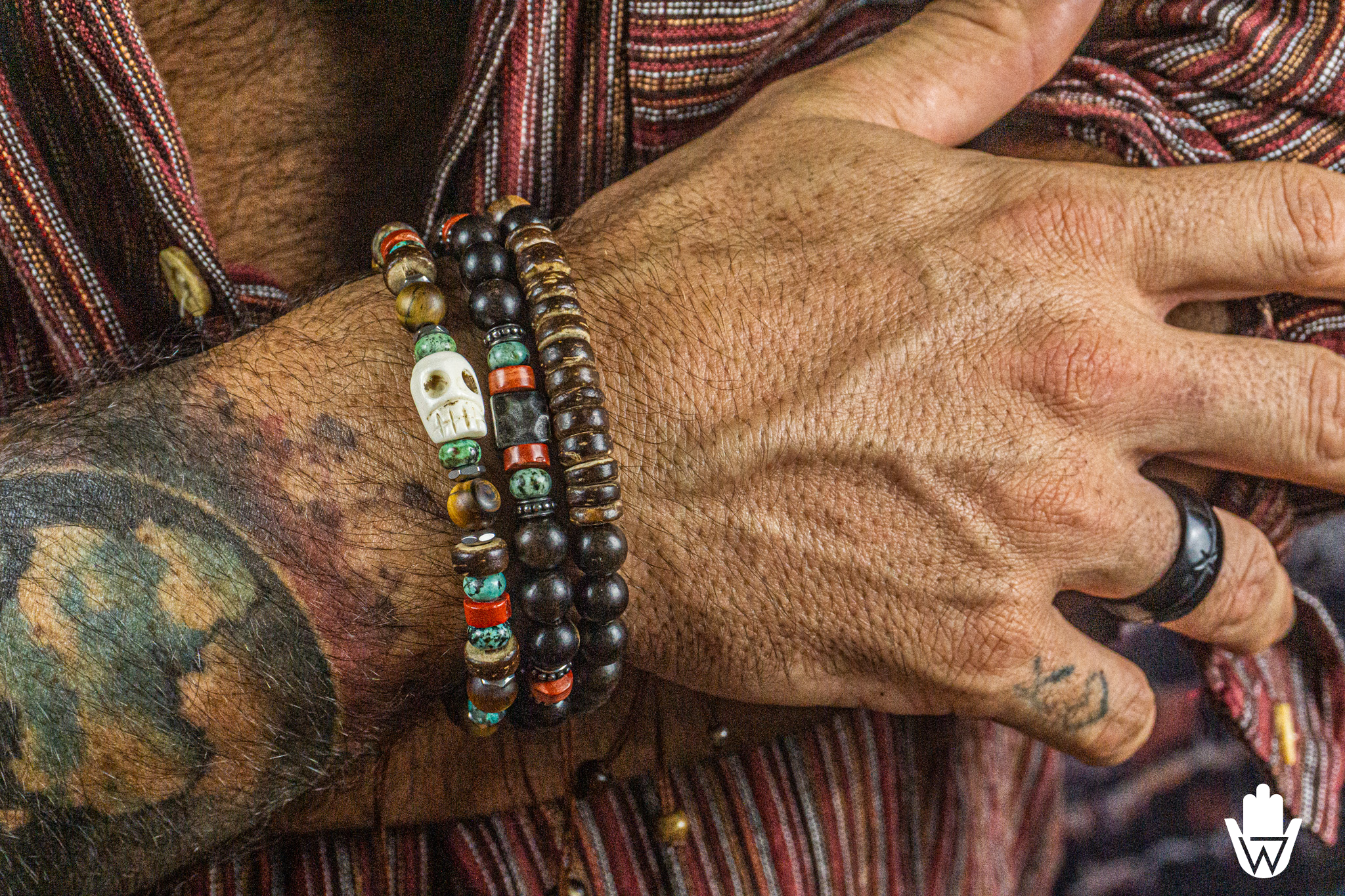mens beaded bracelet set of 3 made of ebony wood, coconut, gemstones, with a skull charm as central piece- wander jewellery