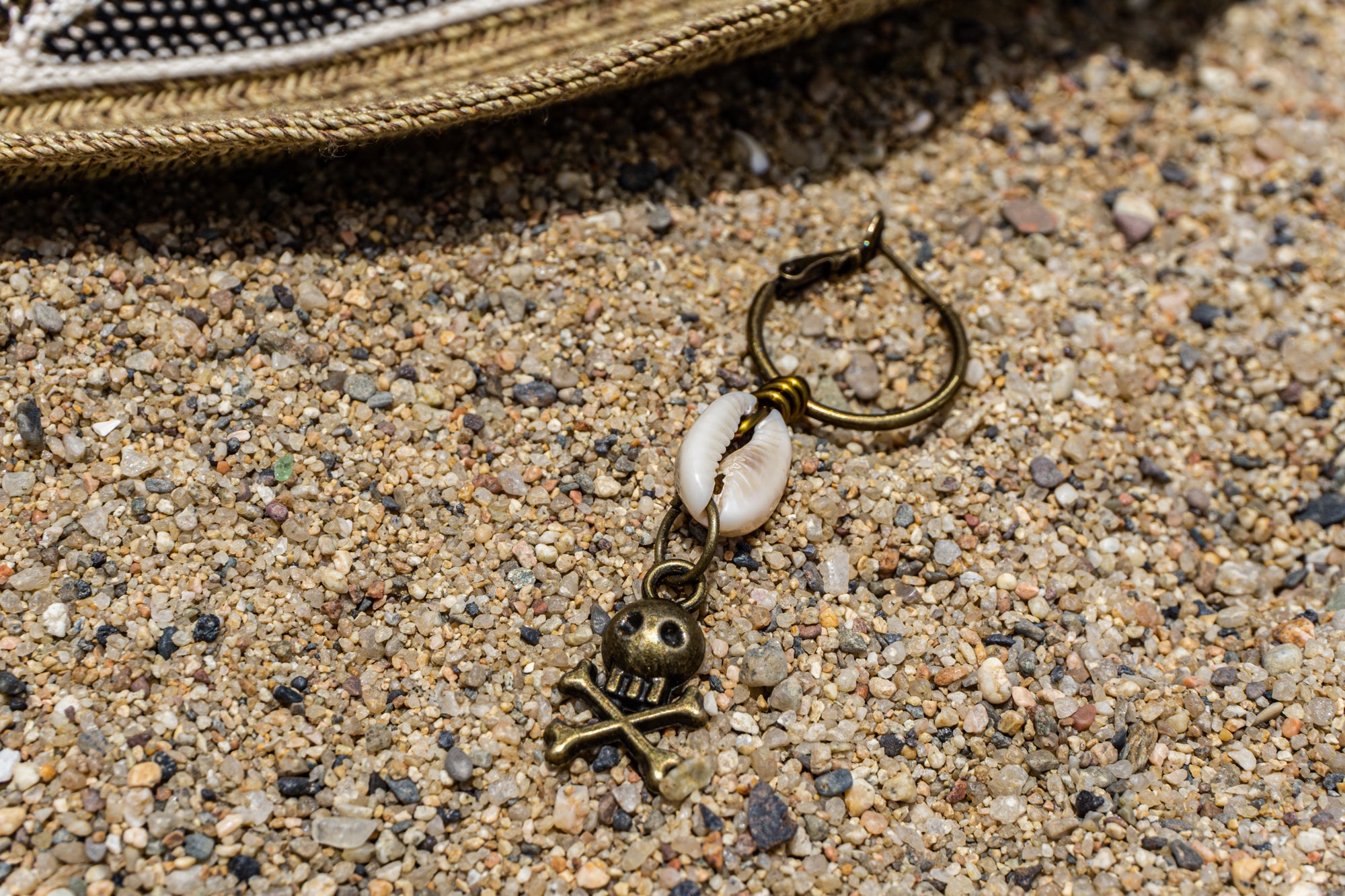 hoop earring with shell and jolly roger skull dangle- wander jewellery