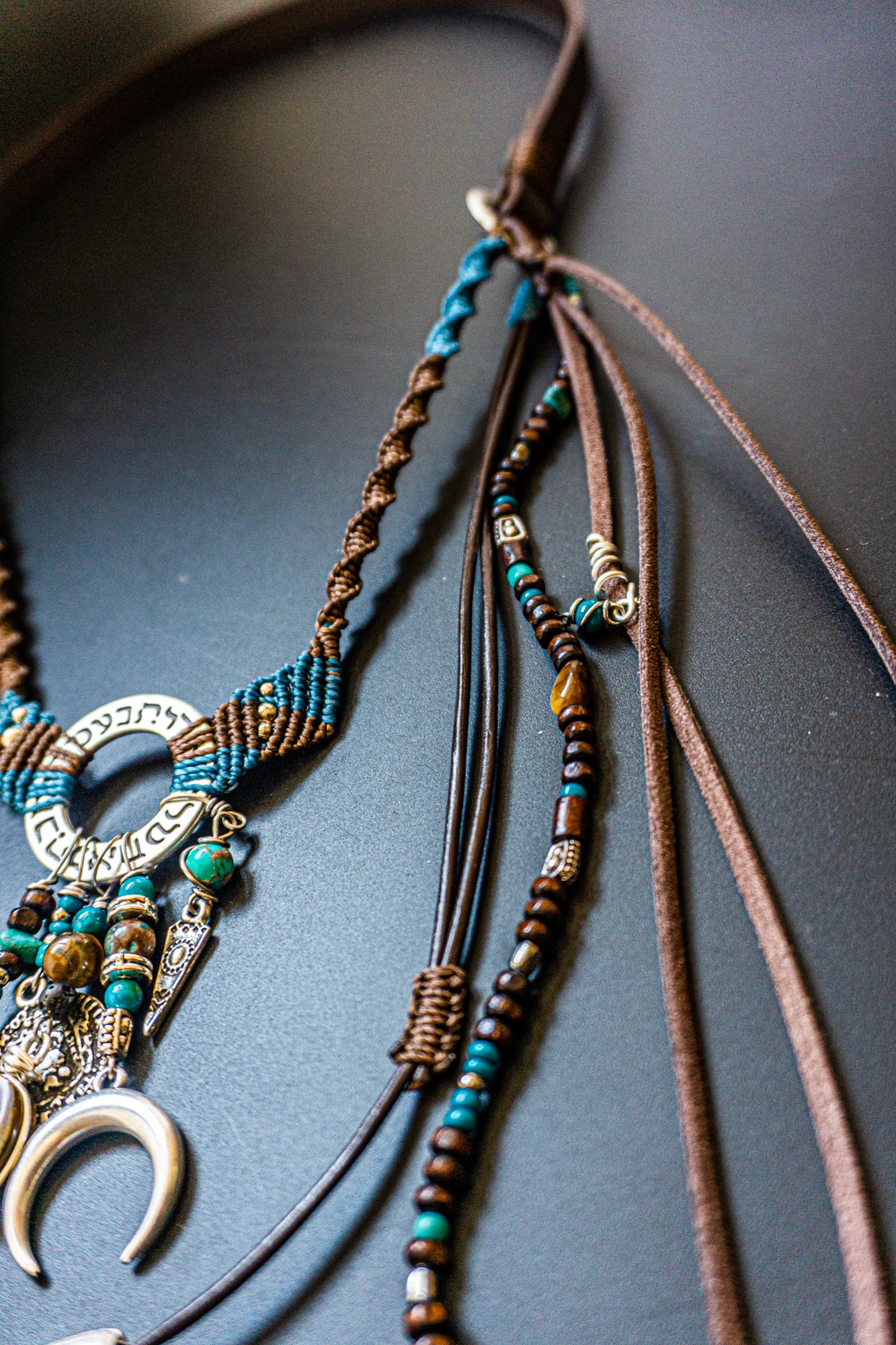 boho necklace made of macrame aand leather, with different layers charms and dangling beaded strings and fringes- wander jewellery