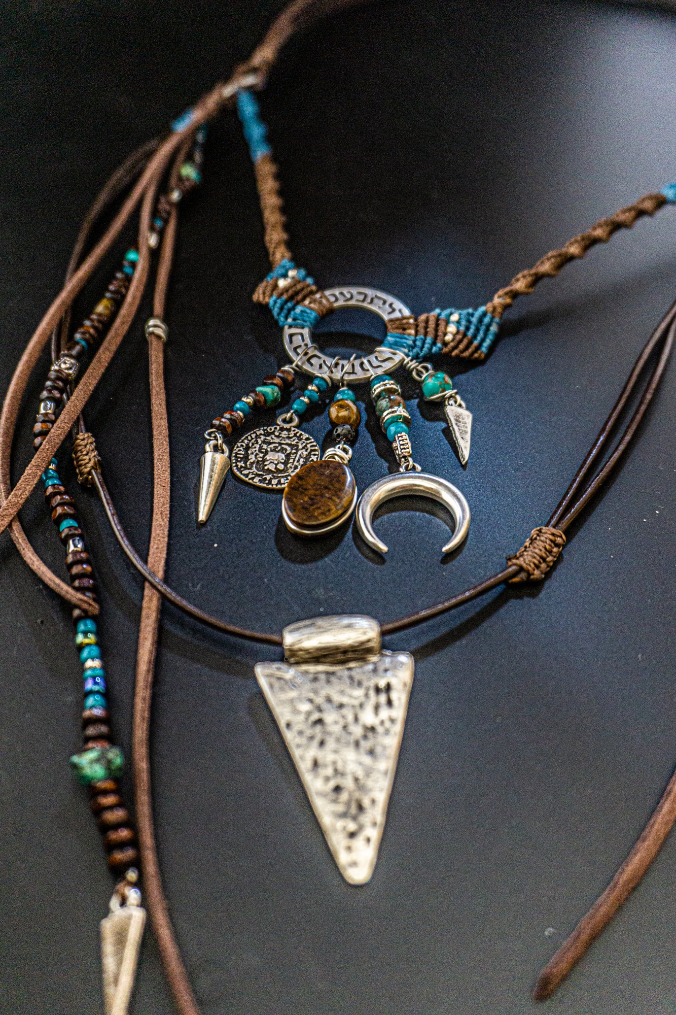 tribal statement necklace made of macrame aand leather,  with different layers charms and dangling beaded strings and fringes- wander jewellery