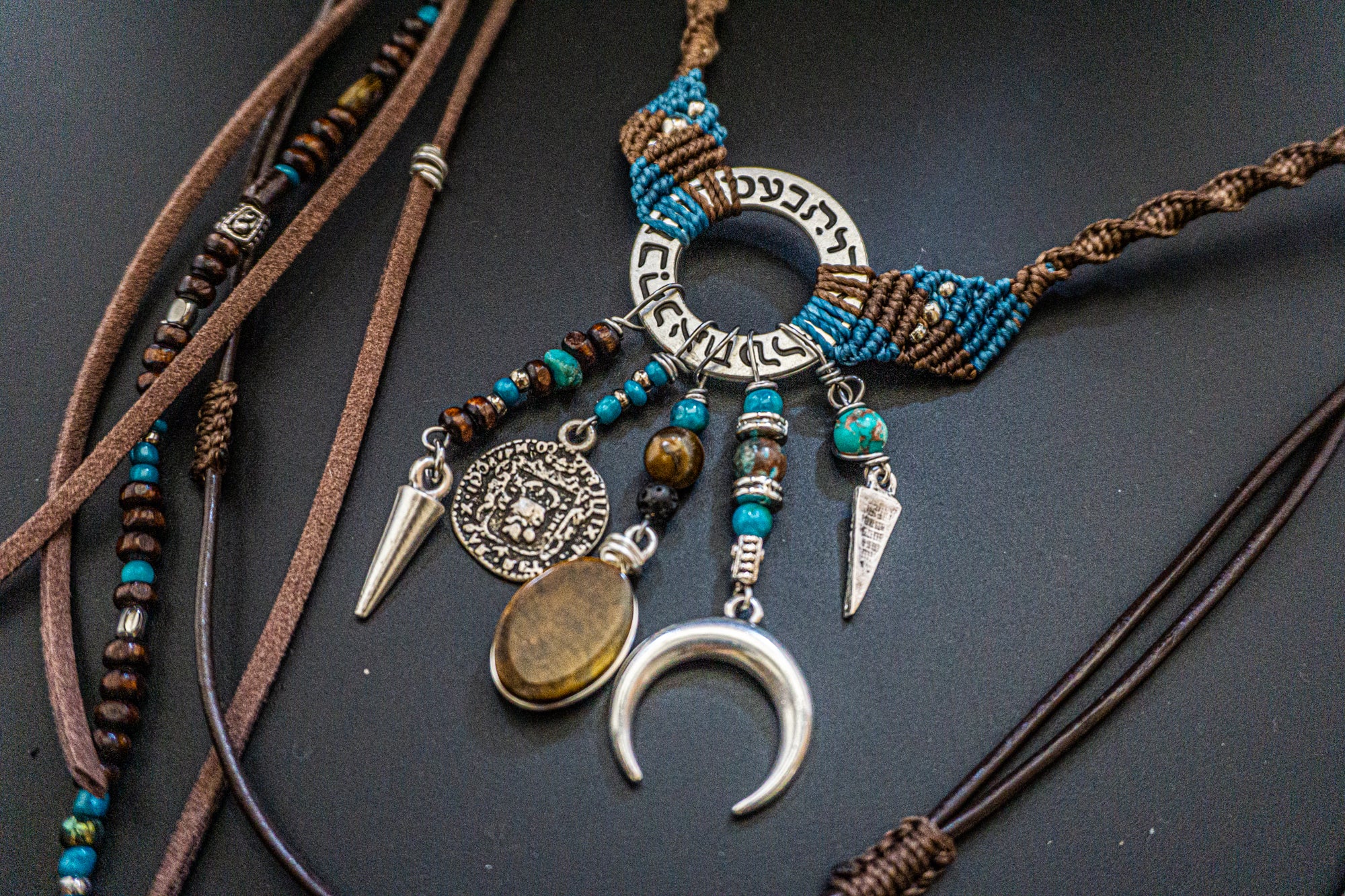 statement necklace made of macrame aand leather, with different layers charms and dangling beaded strings and fringes- wander jewellery