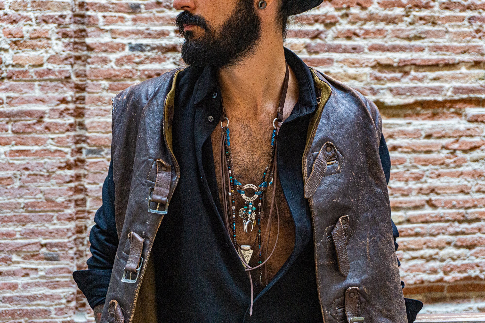 mens boho statement necklace made of macrame aand leather, with different layers charms and dangling beaded strings and fringes- wander jewellery