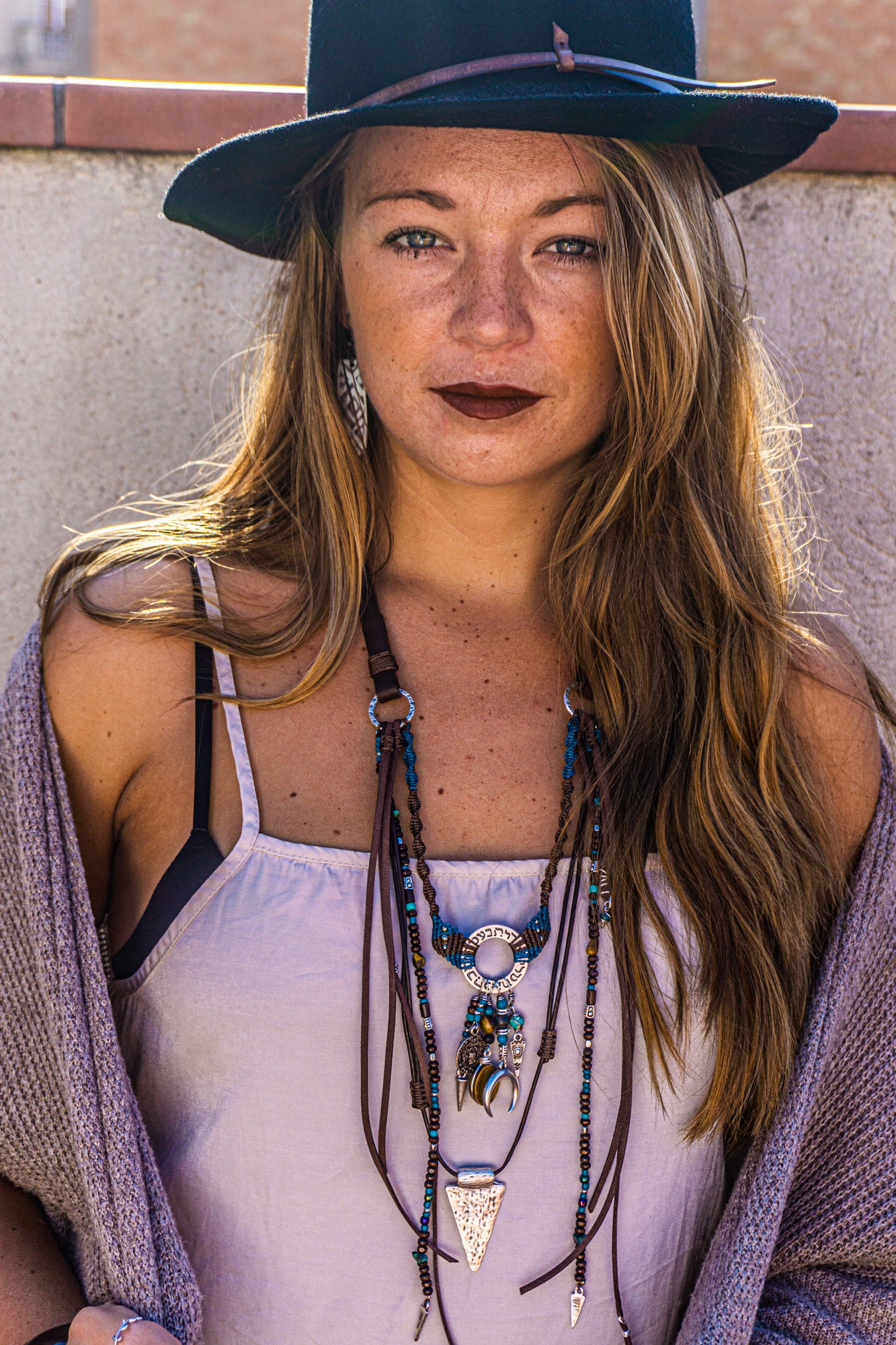 womens boho statement necklace made of macrame aand leather, with different layers charms and dangling beaded strings and fringes- wander jewellery