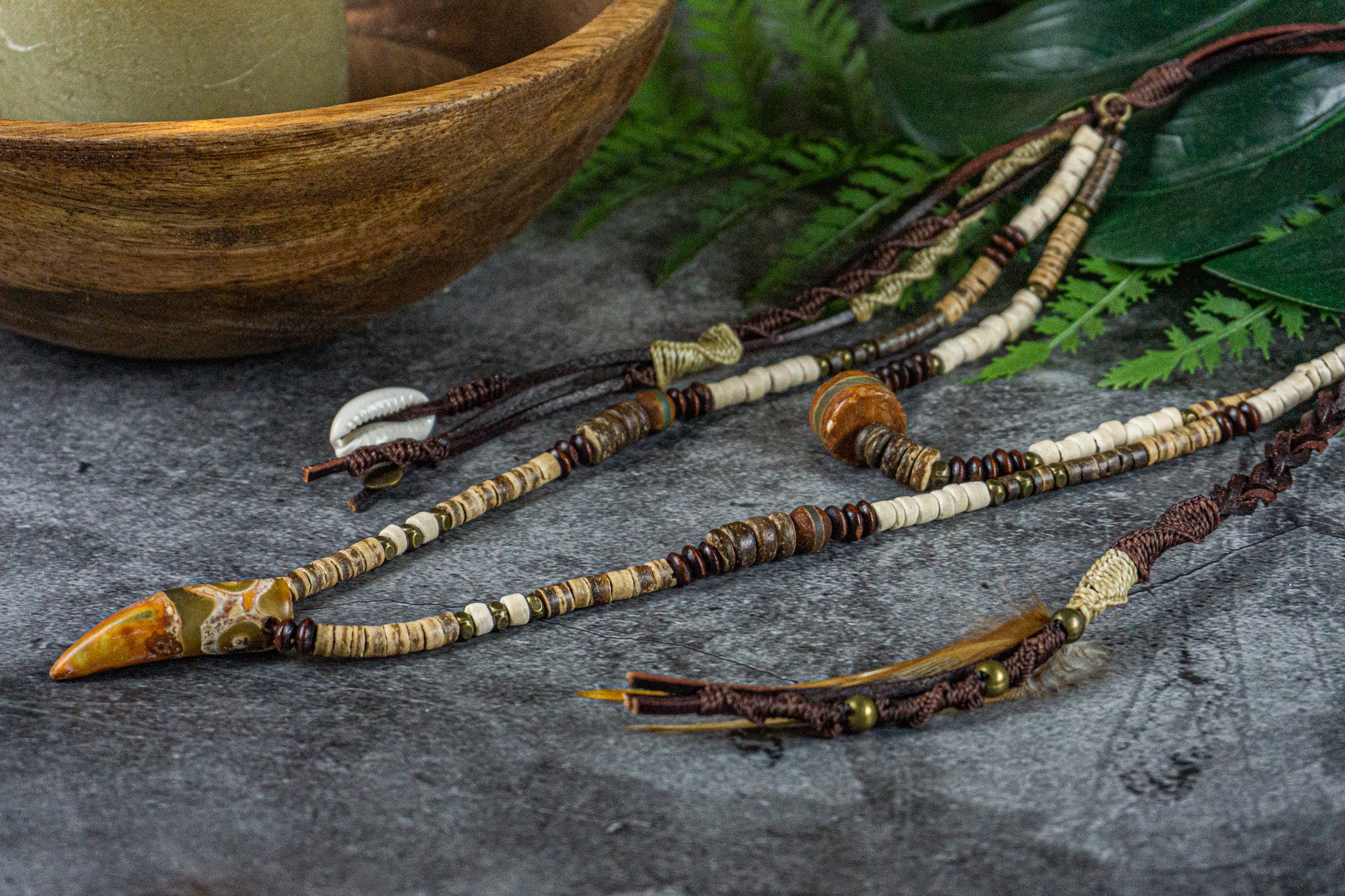 leather and coconut long layered pendant necklace set with dangling charms and feather- wander jewellery