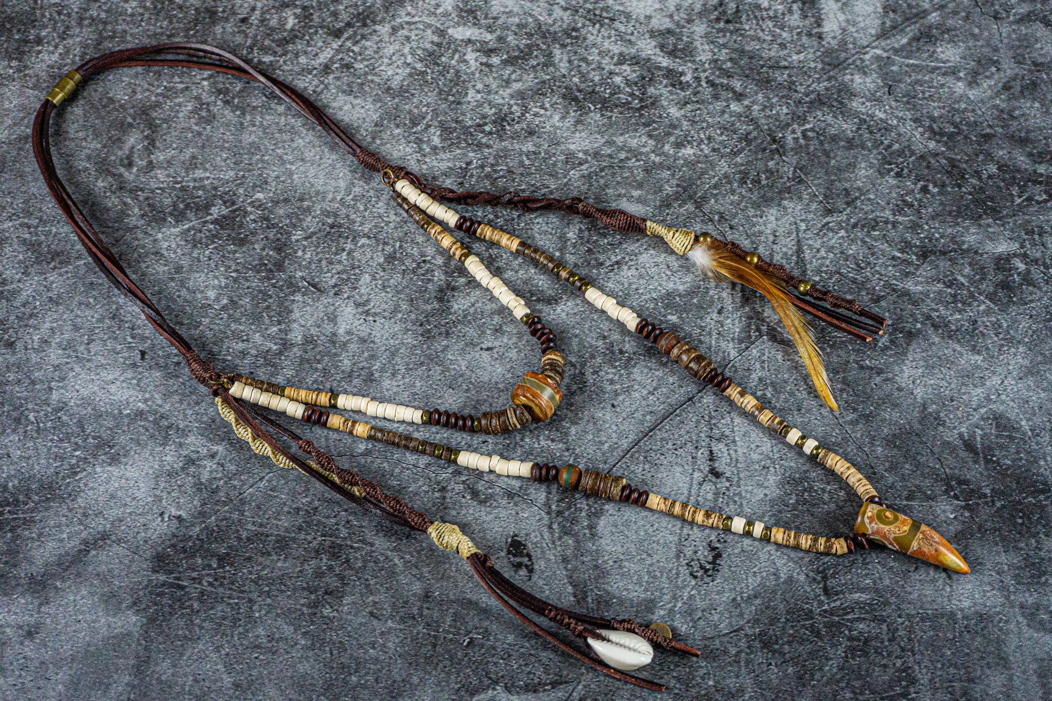 leather coconut and wood layered pendant necklace set with dangling charms and feather- wander jewellery