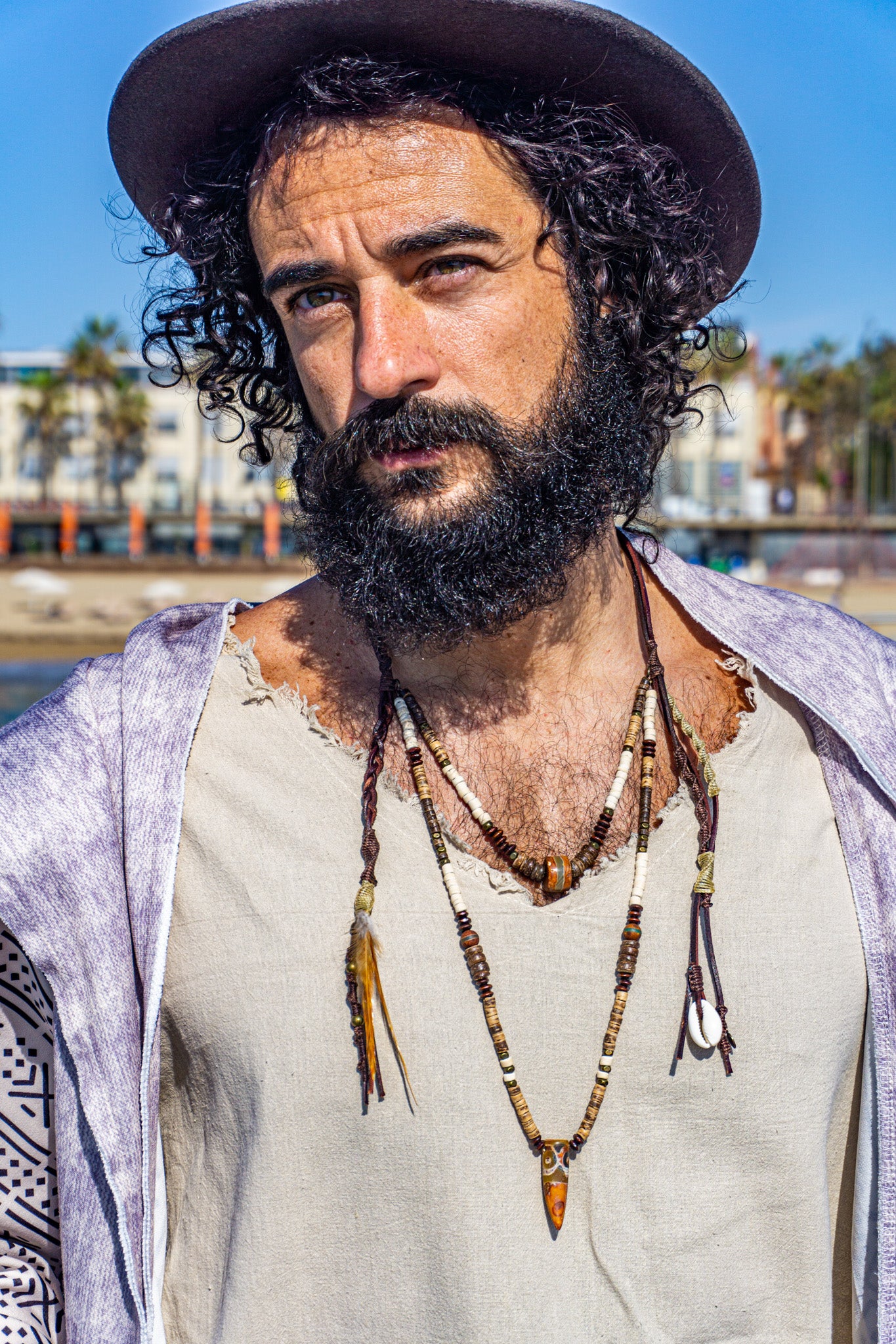 mens leather coconut and wood long layered pendant necklace set with dangling charms and feather- wander jewellery