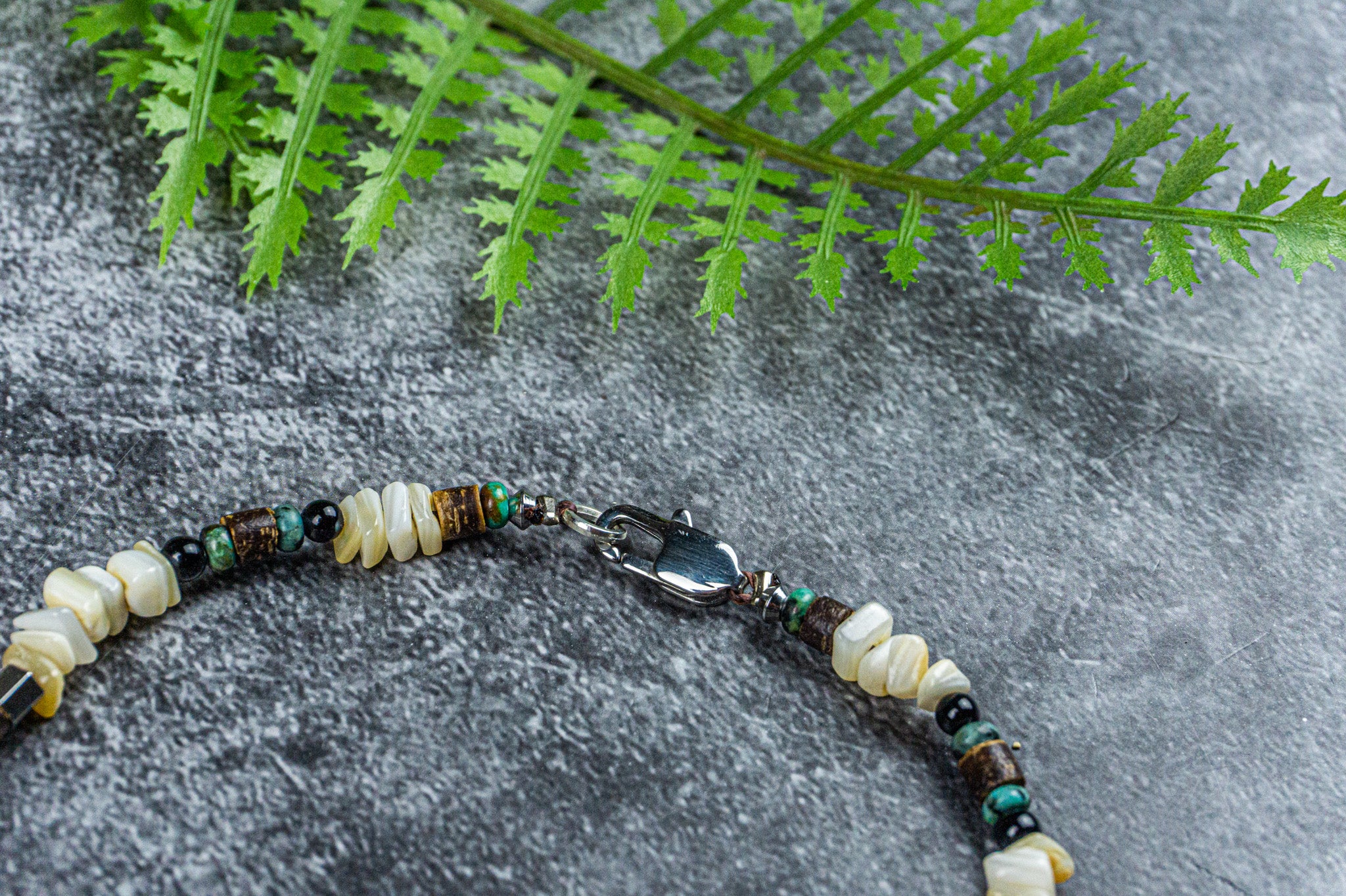 coral anklet with green jasper gemstone and a cowrie shell- wander jewellery