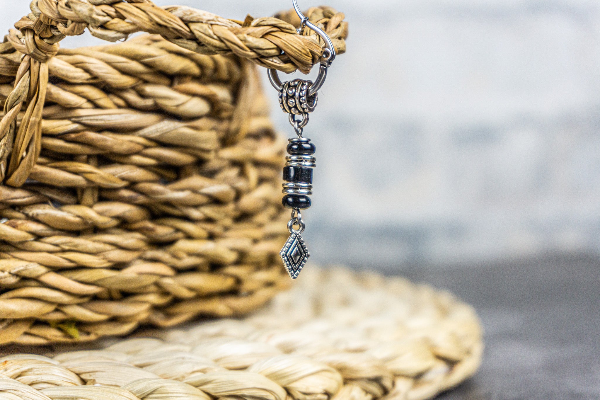 black earring with silver and onyx