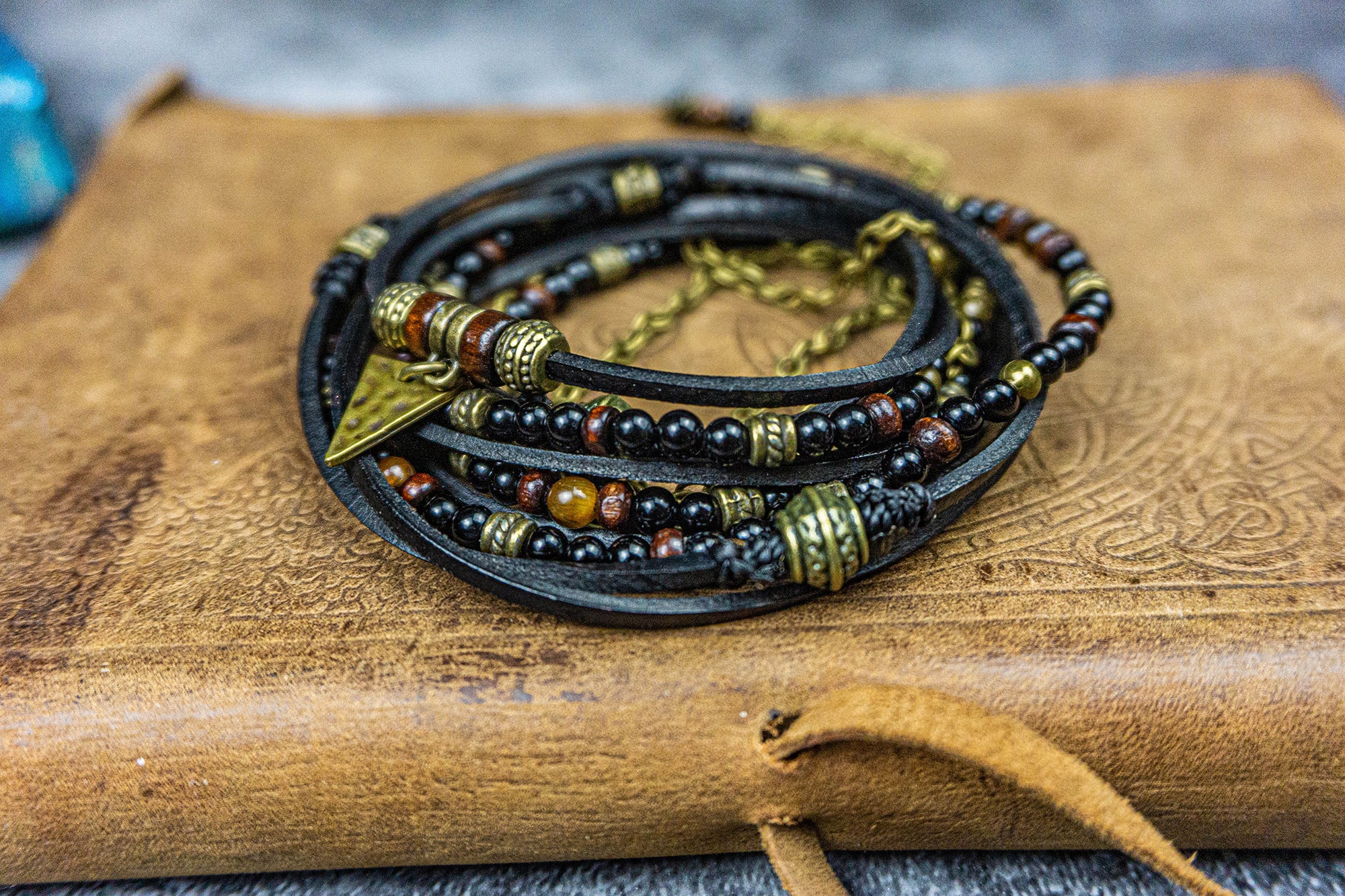 boho mens bracelet made of black onyx, wood , leather and brass