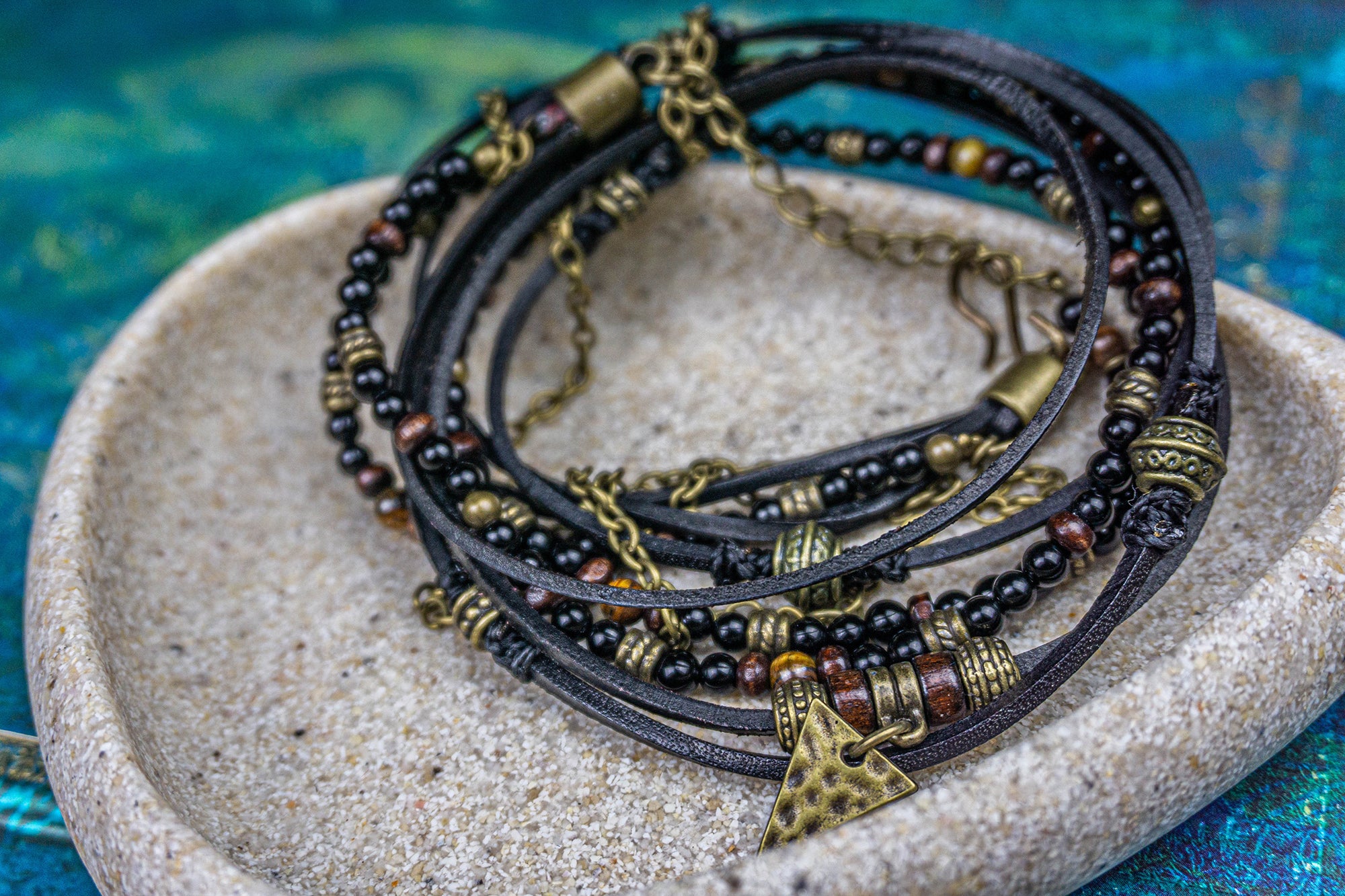 black onyx, wood , black leather and brass beaded wrap bracelet