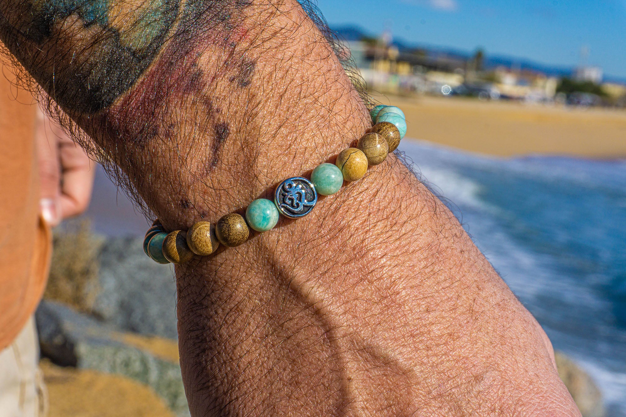 camphor wood amazonite turquose om beaded bracelet