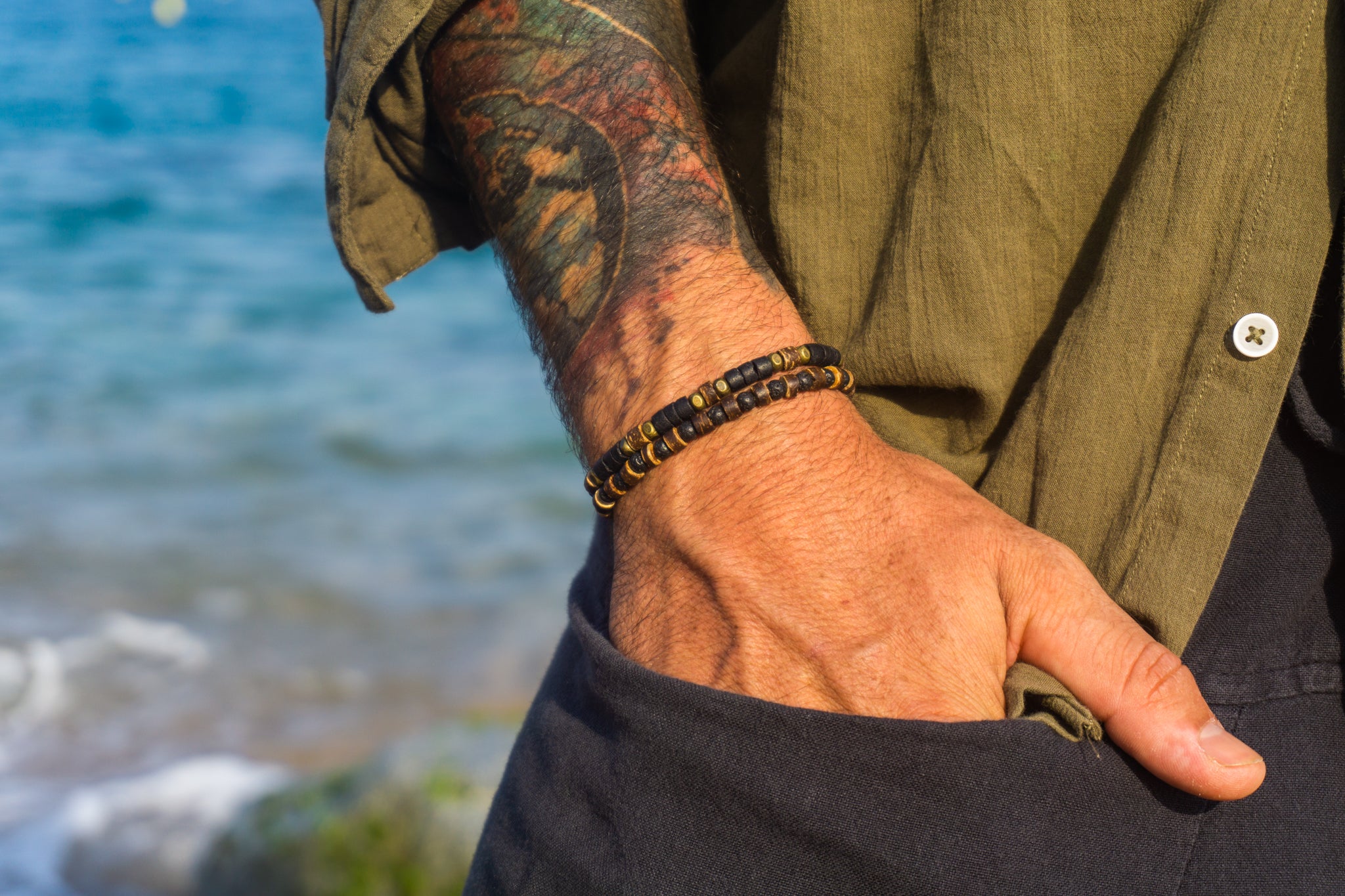 mens double bracelet made of one black and brown cococnut bracelet and a lava stone and coconut bracelet- wander jewellery