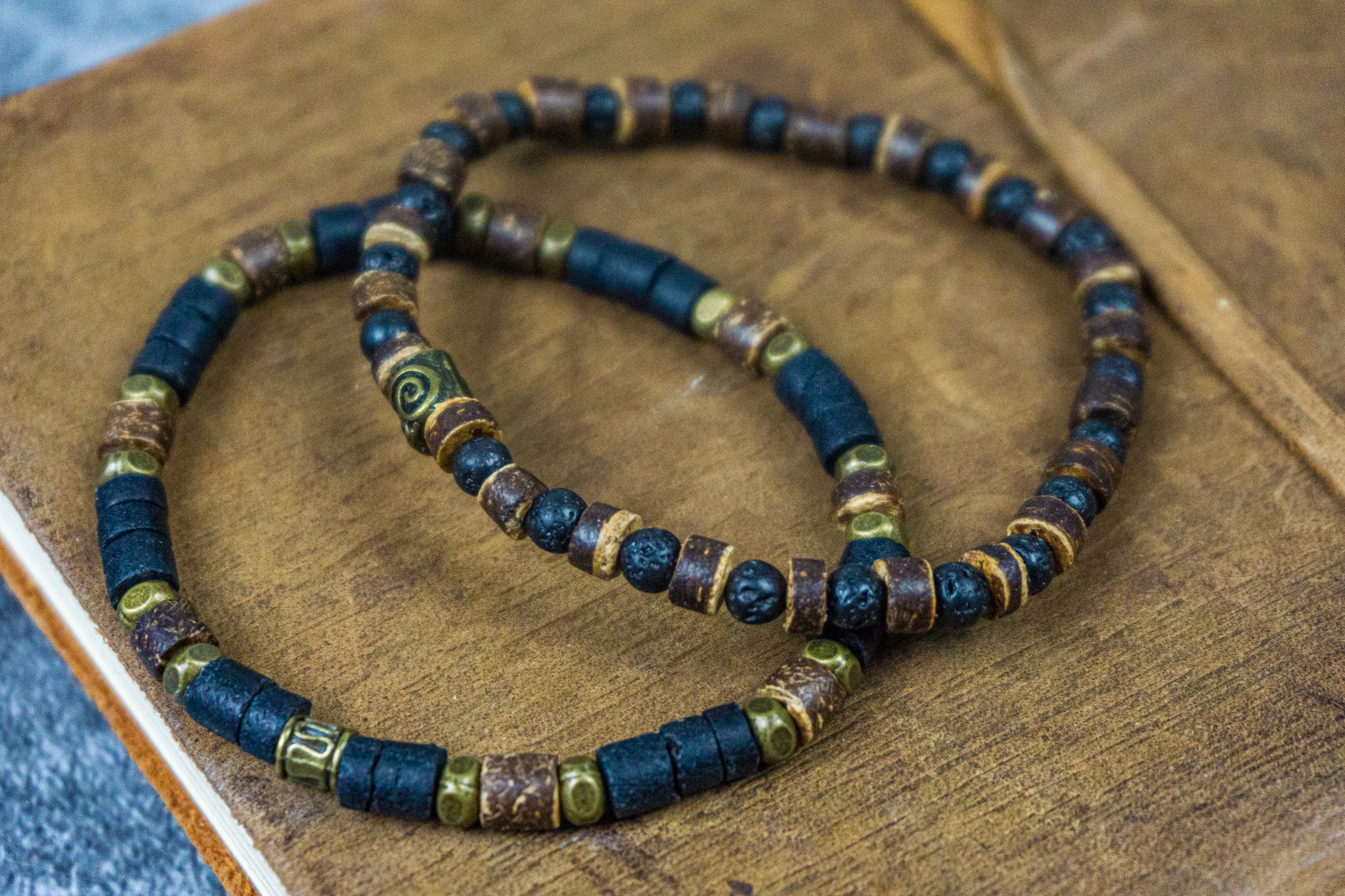 mens double bracelet set made of one black and brown cococnut bracelet and a lava stone and coconut bracelet- wander jewellery