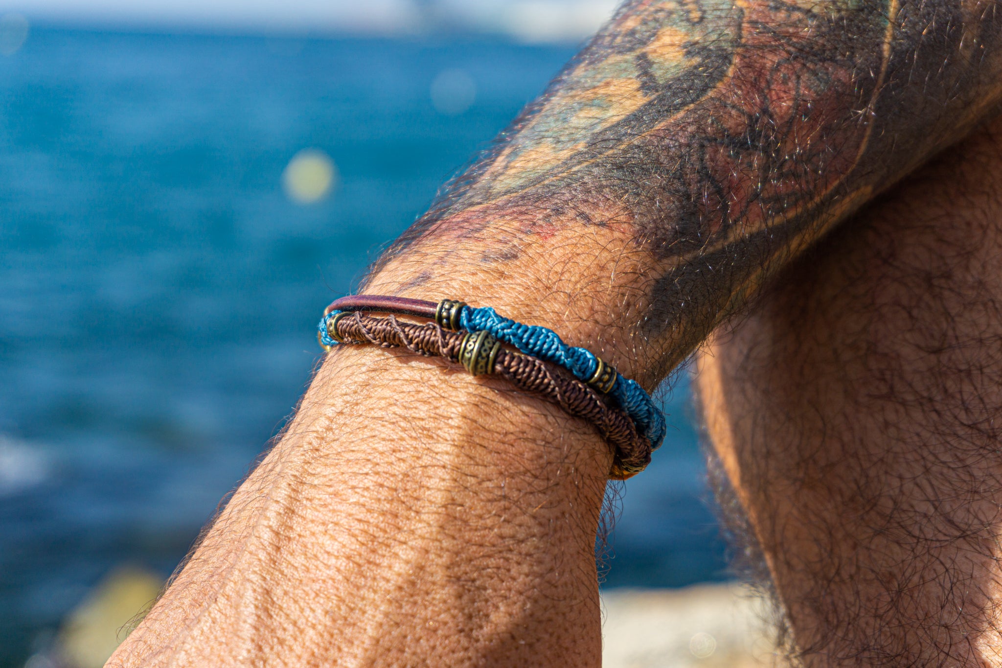 mens blue brown and orange colorful bracelet set made of leather and decoreted with bronxe details and macrame patterns- wander jewellery