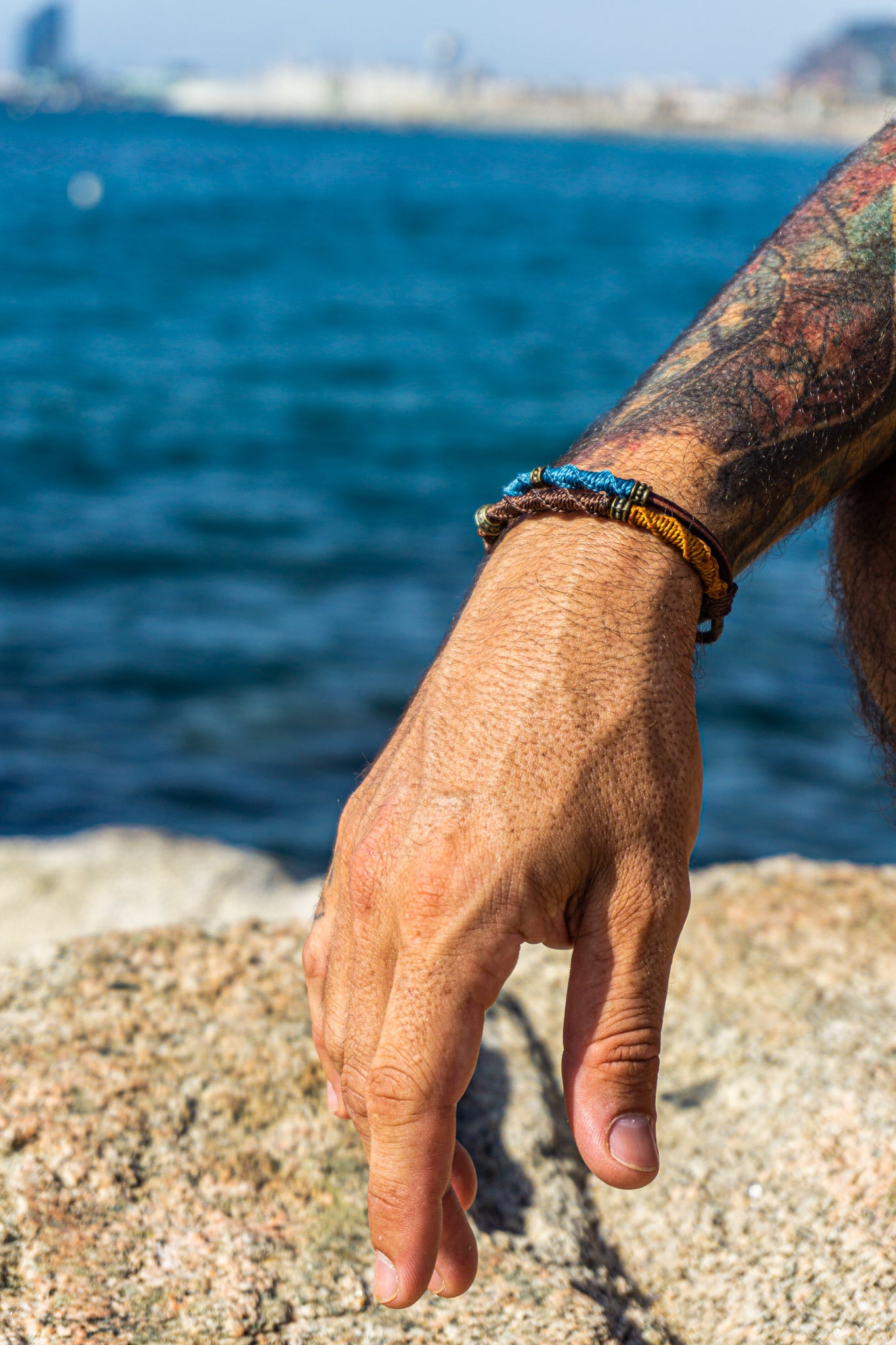 colorful bracelet set made of leather and decoreted with bronxe details and macrame design- wander jewellery