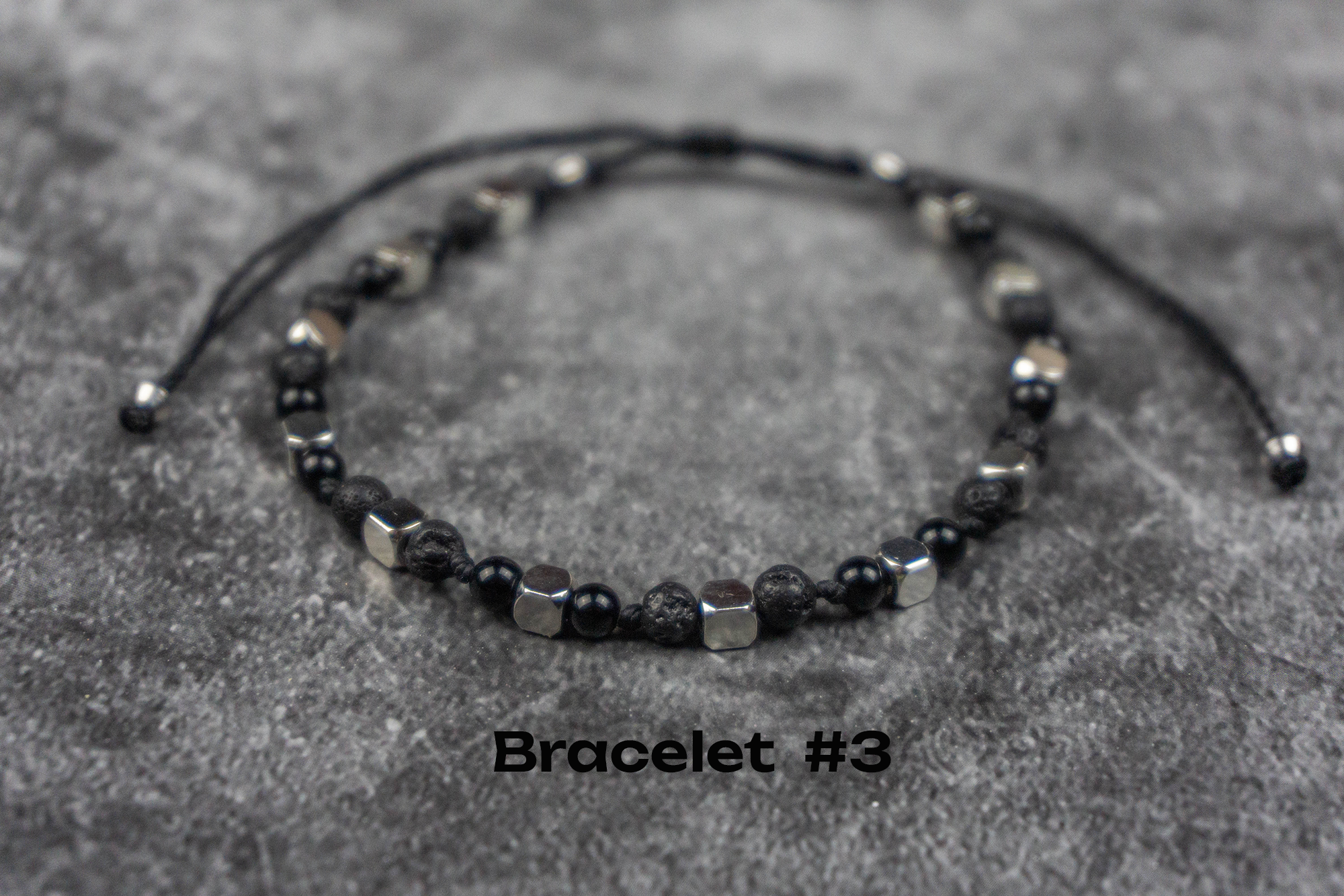 onyx and lava stone and stainless steel adjustable bracelet