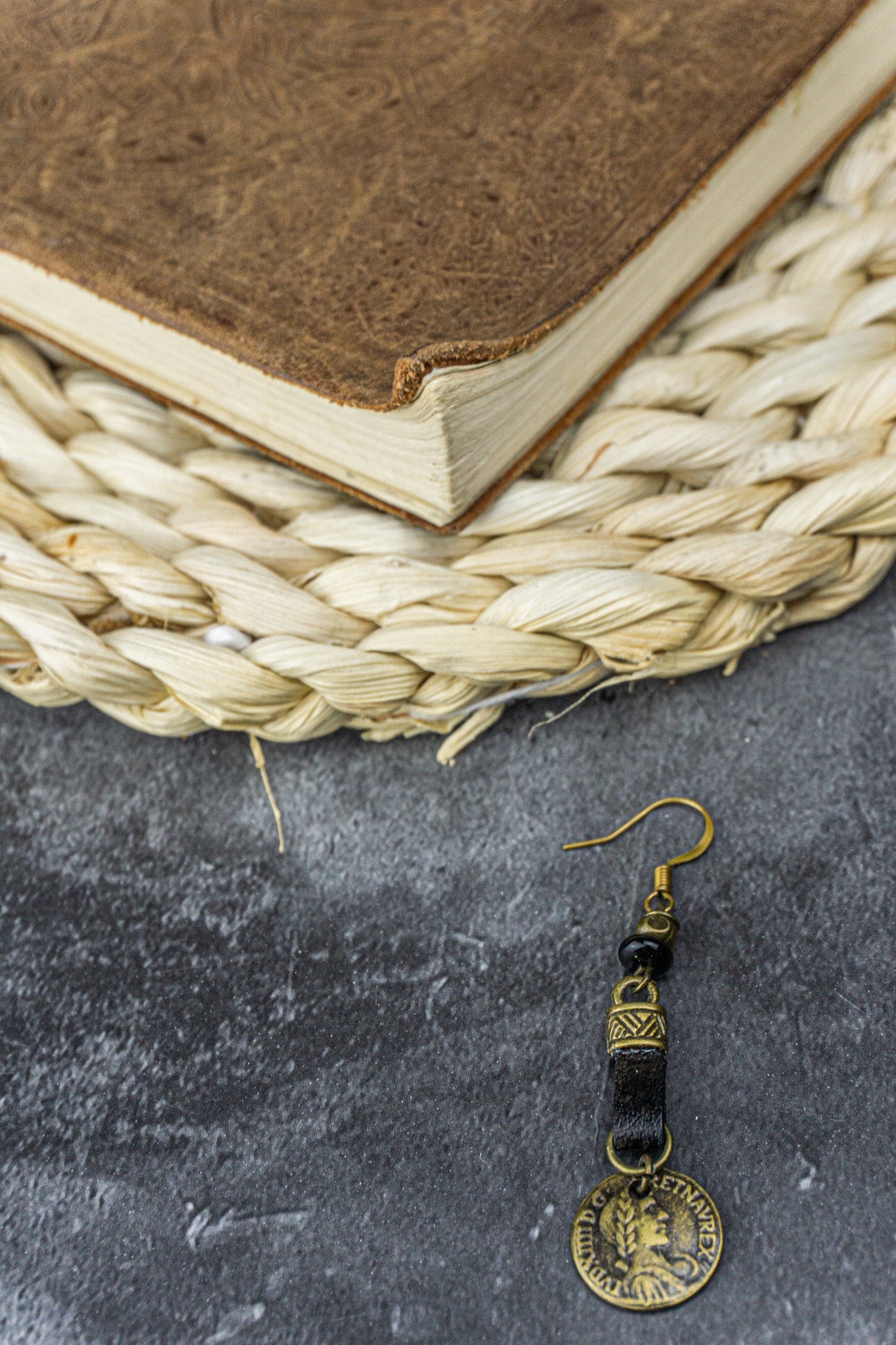 long dangling earring for men with leather and a coin