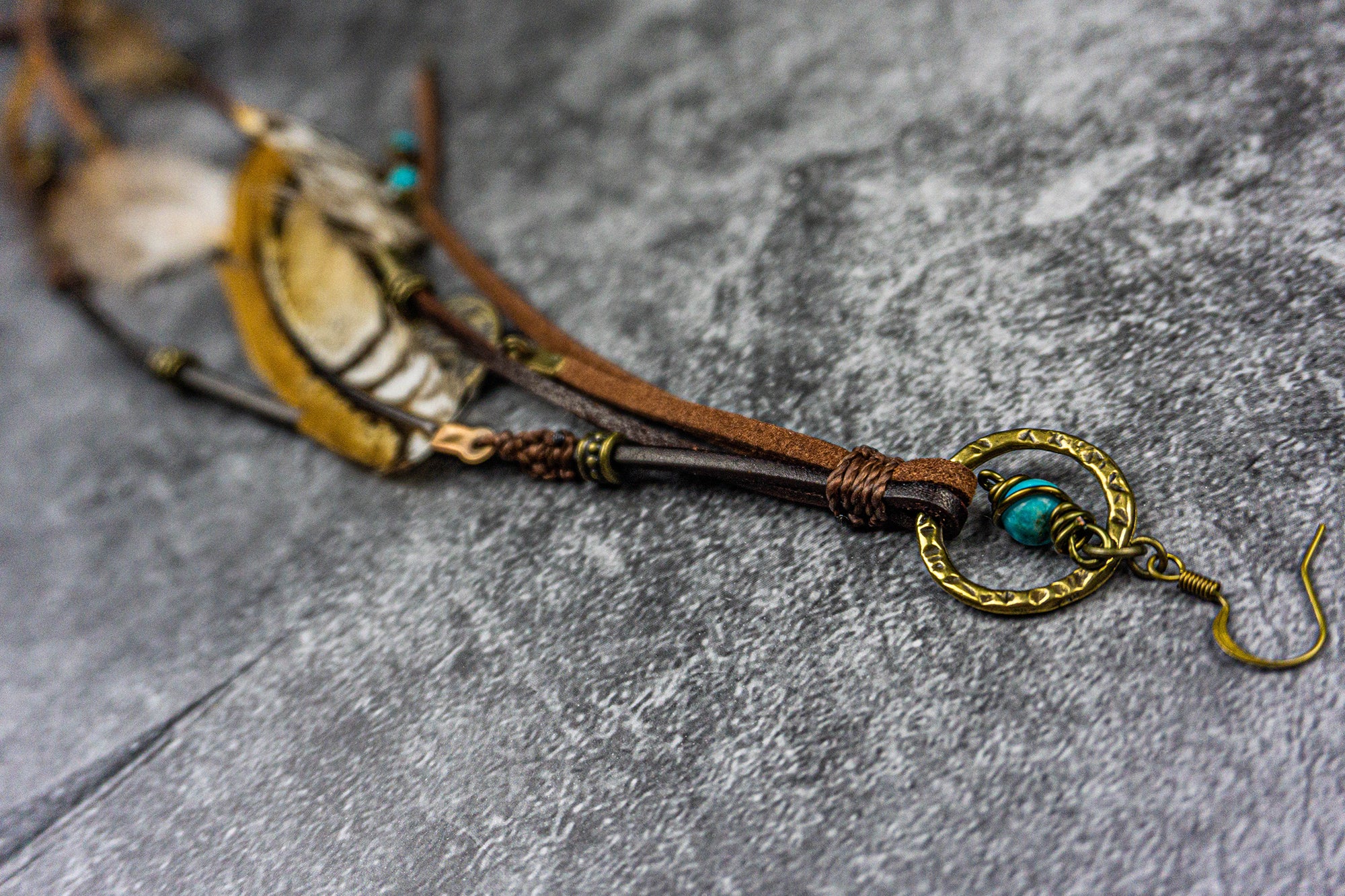 hook earring with a dangle turquoise gemstone, long leathers fringes and feathers-wander jewellery