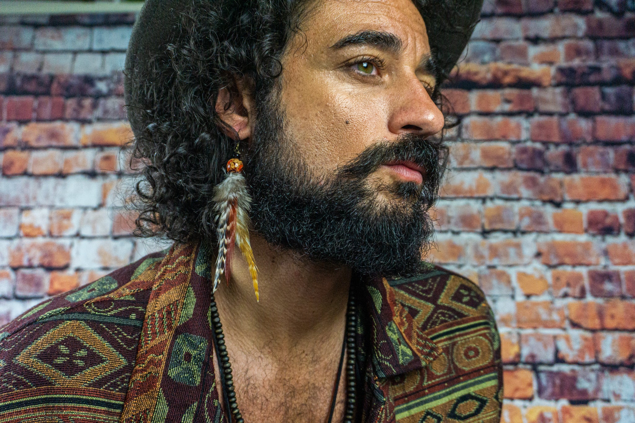 mens-wearing-long-feather-earring