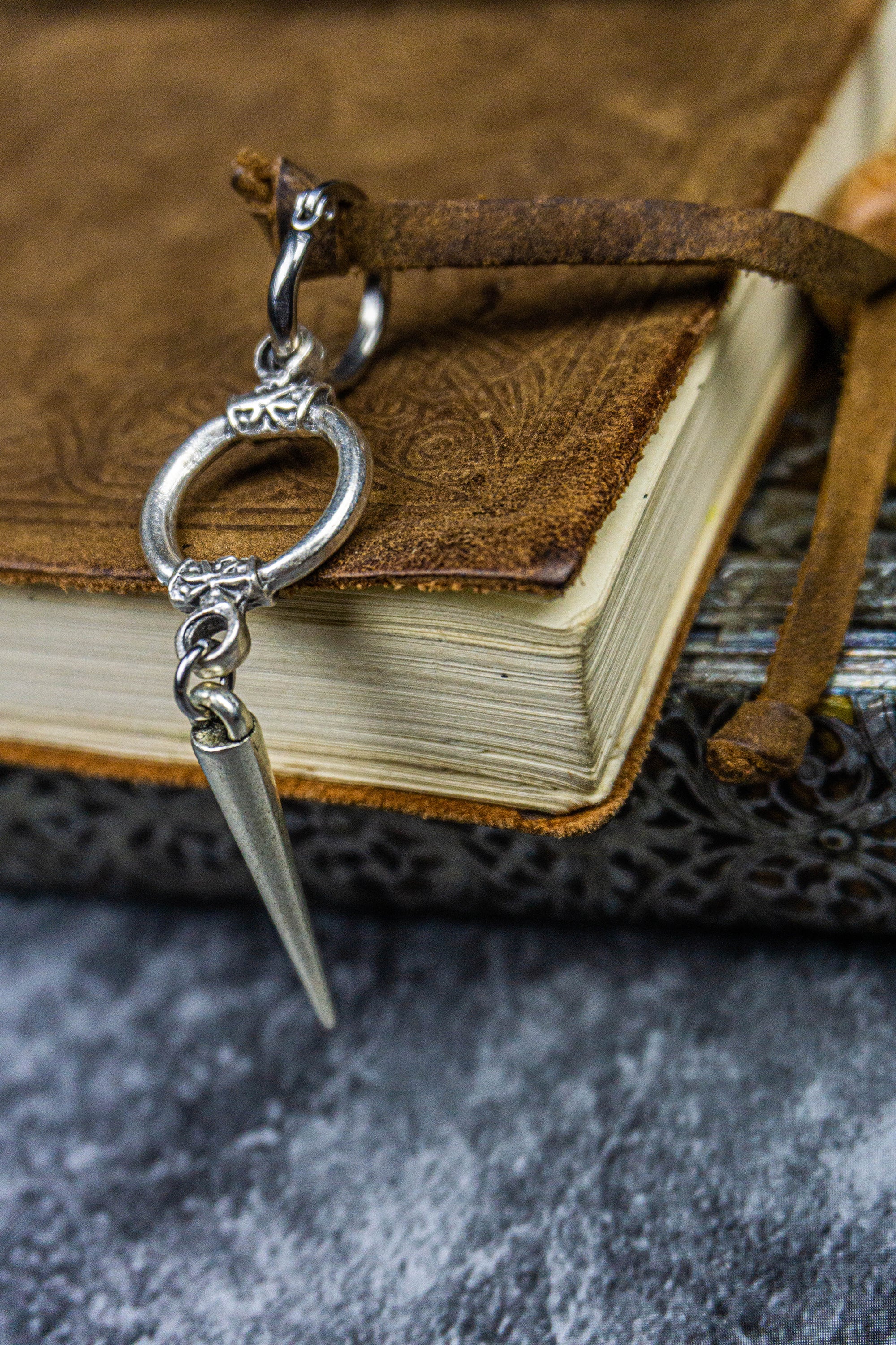 hoop earring with a circle ring and a dangle spike-wander jewellery