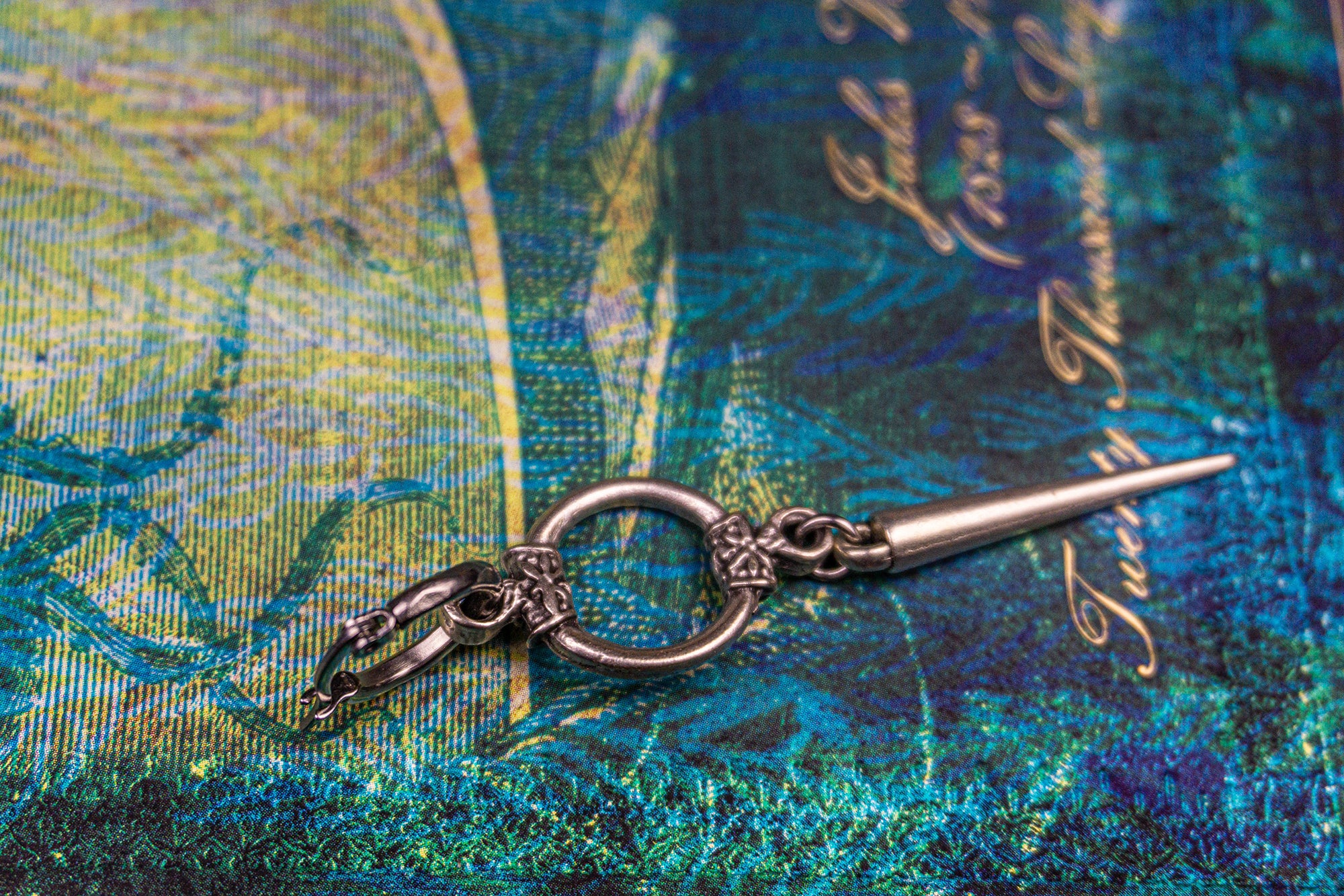 hoop earring with a circle ring and a long spike-wander jewellery
