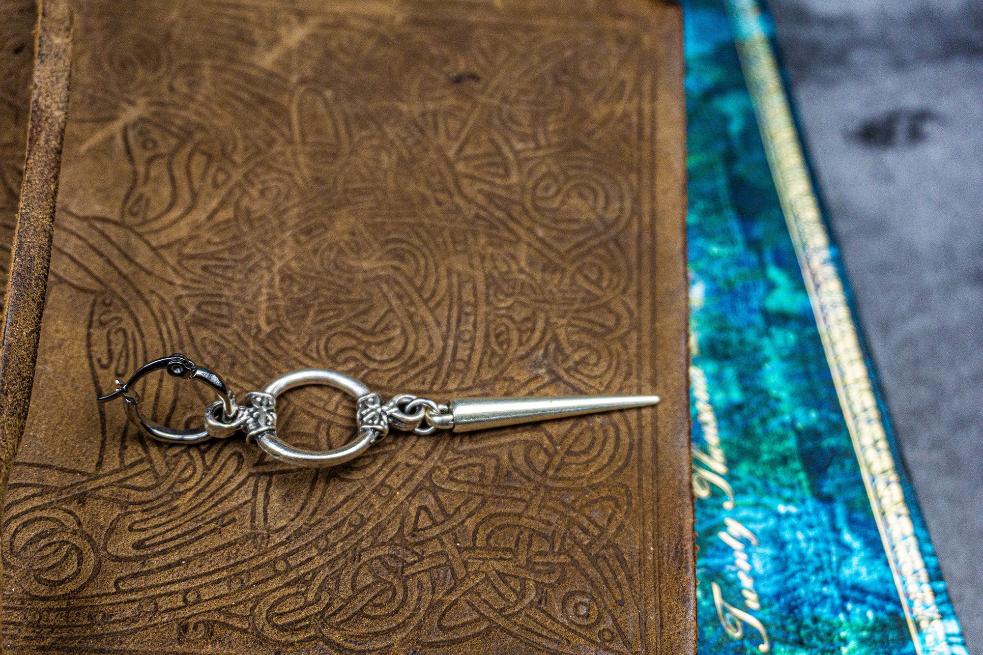 hoop earring with a circle ring and a long dangle spike-wander jewellery